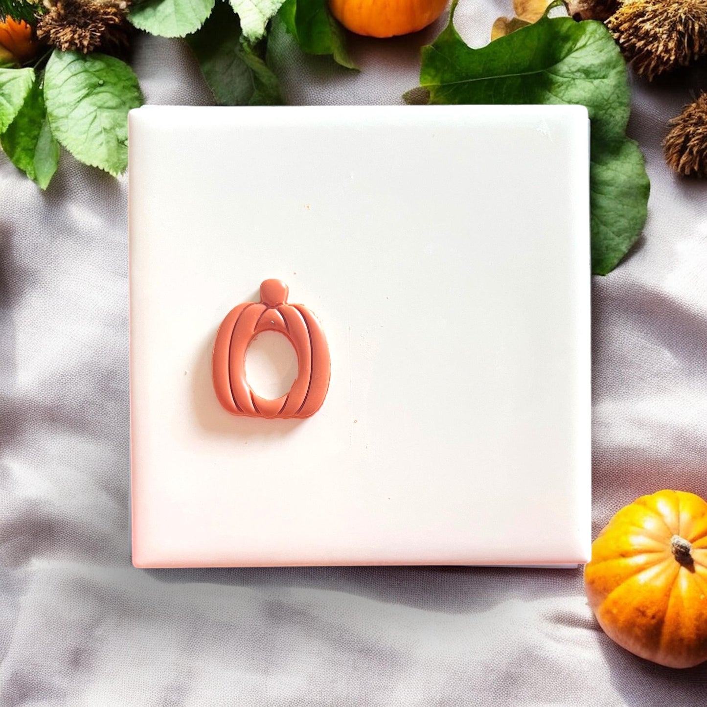 Pumpkin earring made from polymer clay