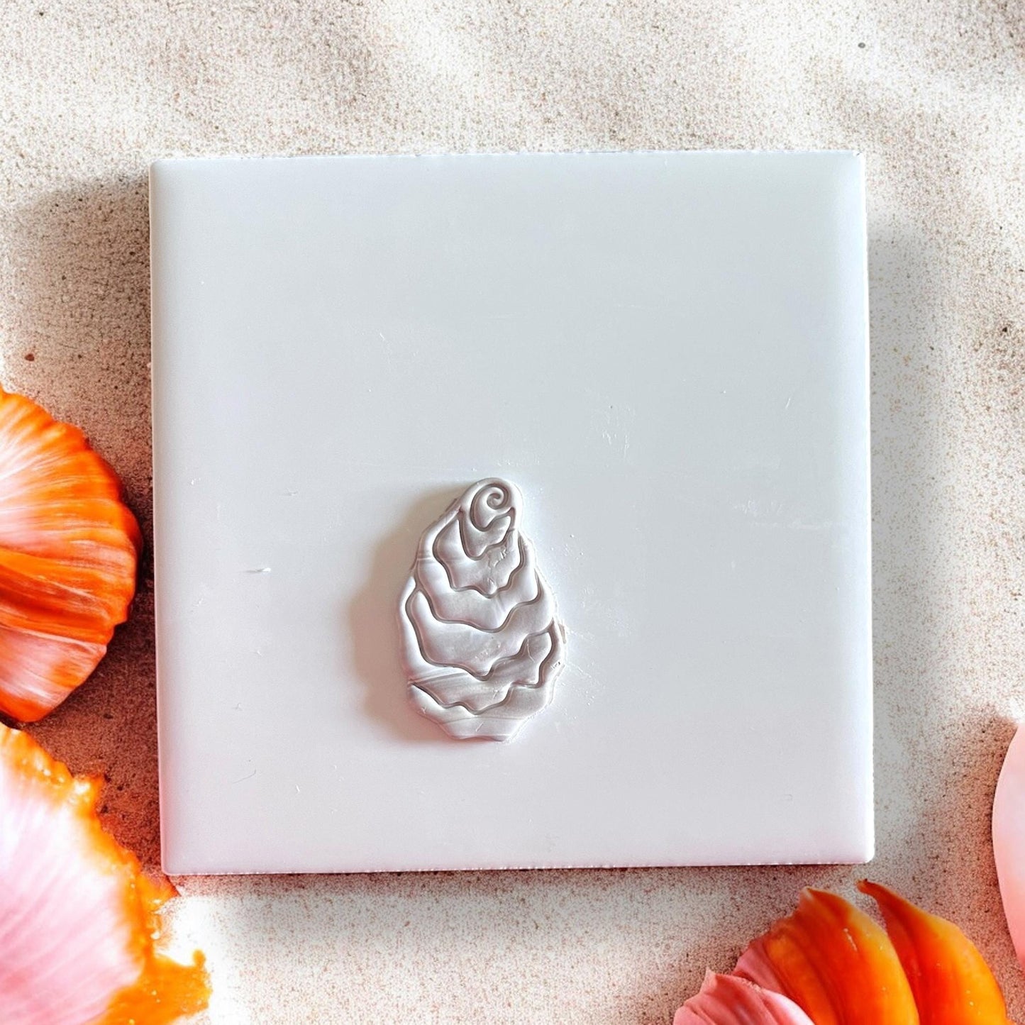 Coastal oyster shell impression from clay earring cutter