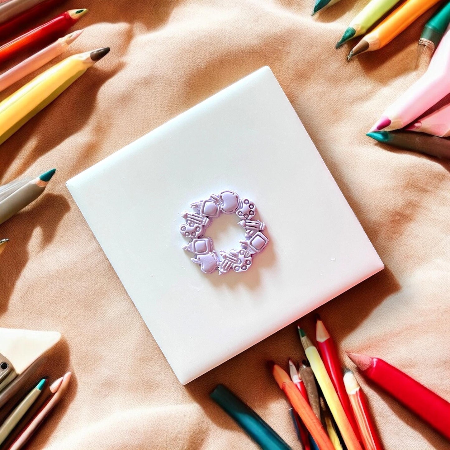 School supply clay earring impression details