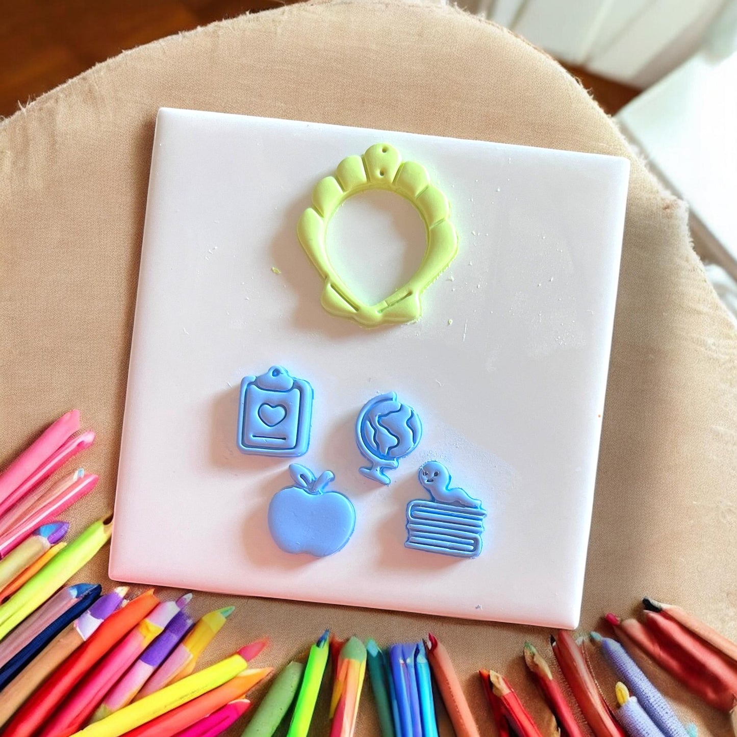 Seashell cutter with pencil and apple