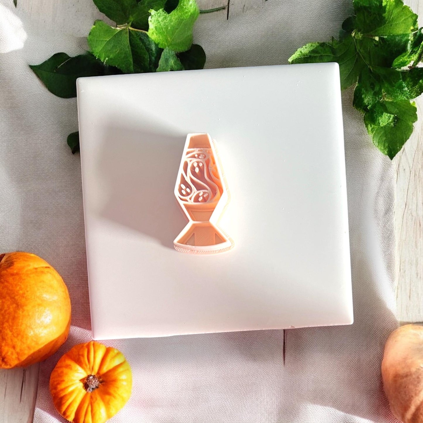 Ghost lava lamp clay cutter on white tile