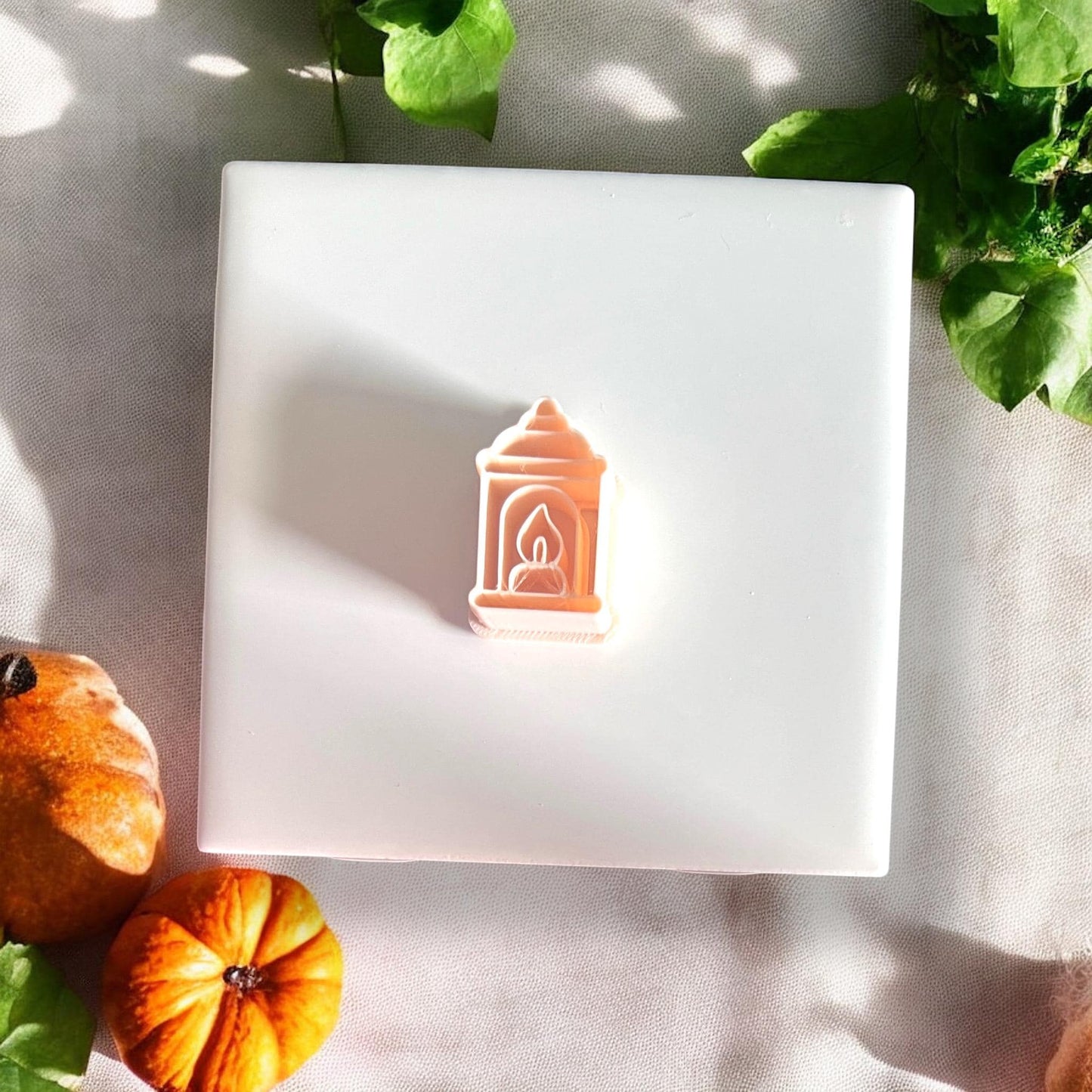 Peach-toned polymer clay cutter shaped like a lantern