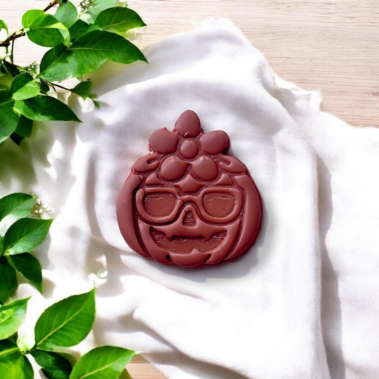 large pumpkin character cutout with floral crown