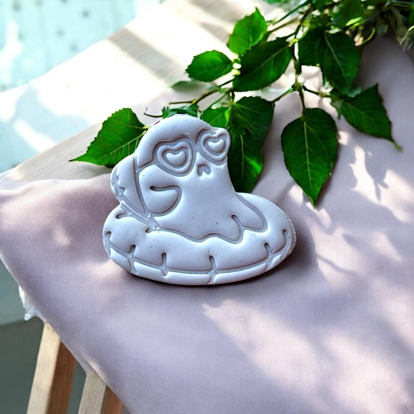 Large clay ghost with floatie and heart-shaped eyes