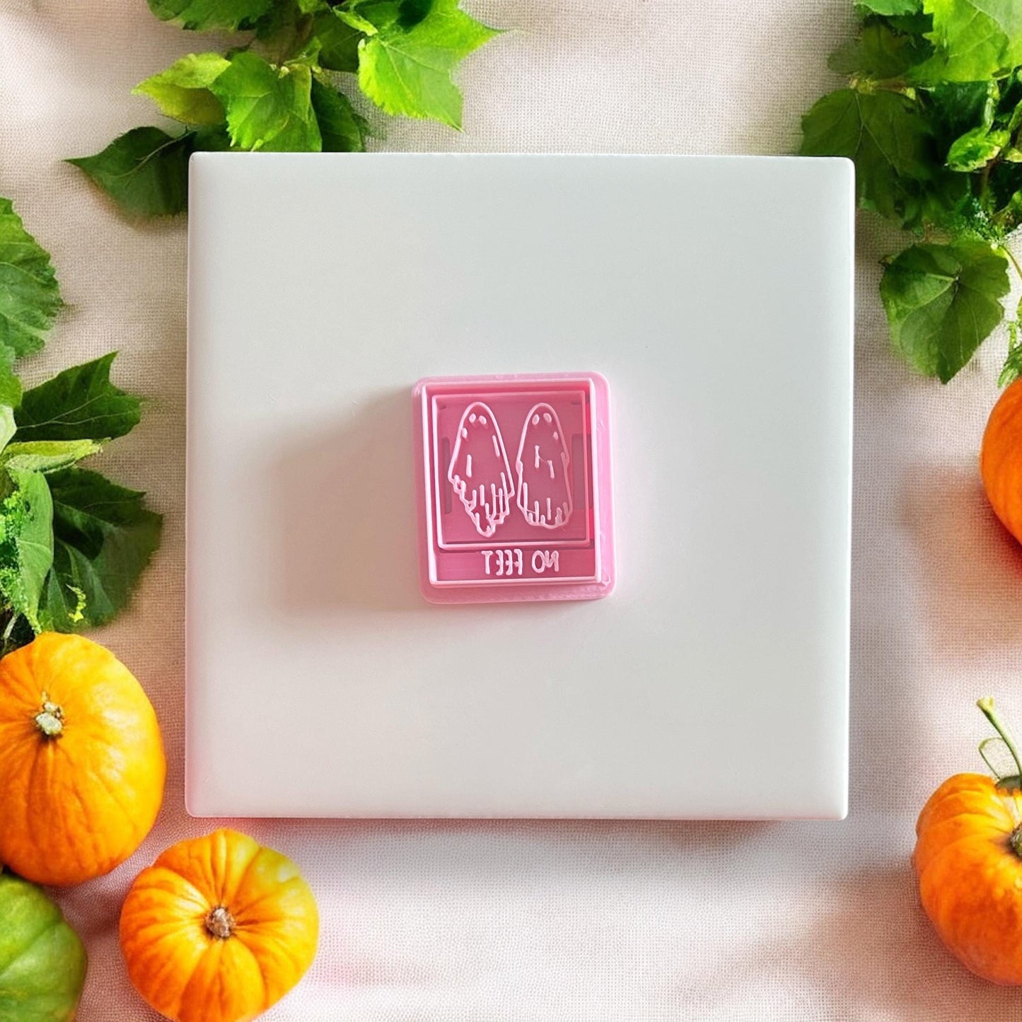 Pink ghost cutter with “No Feet” lettering