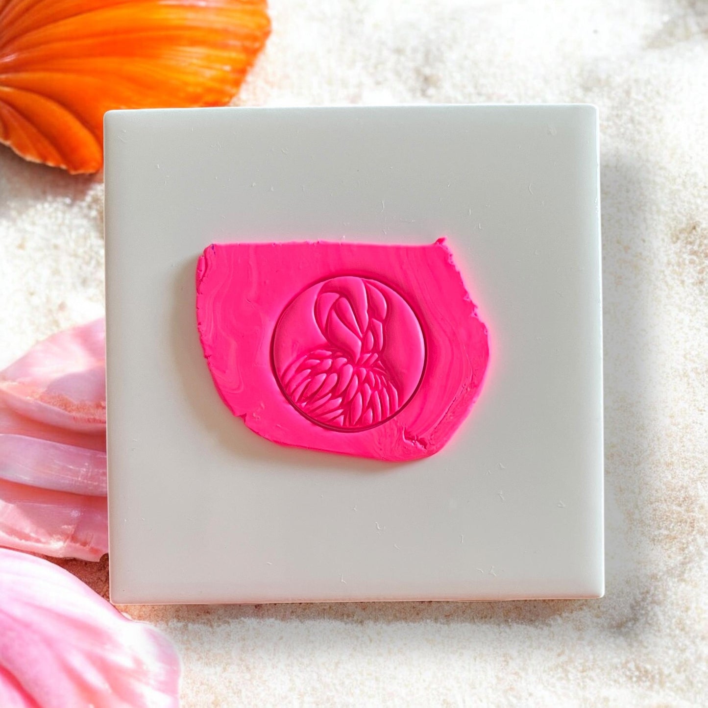 Flamingo silhouette clay impression in bright pink polymer clay