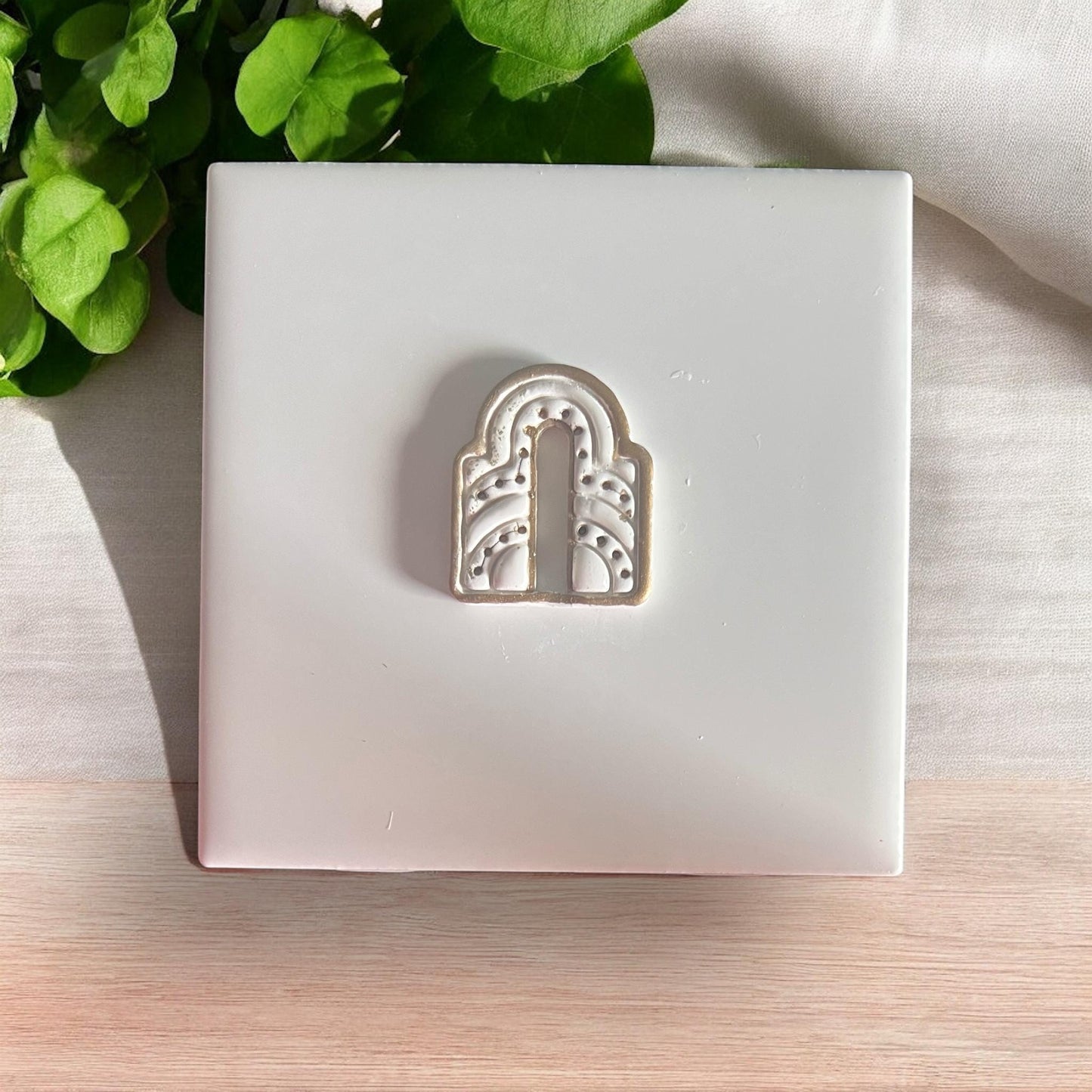 Finished earring with metallic detail