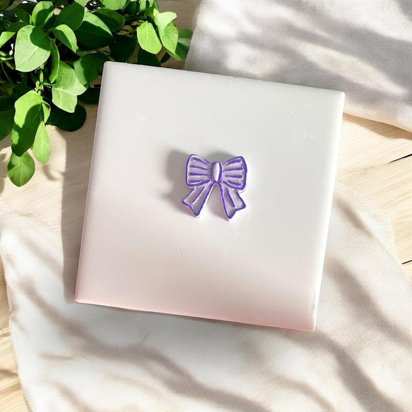 polymer clay bow dangle with ridged detail