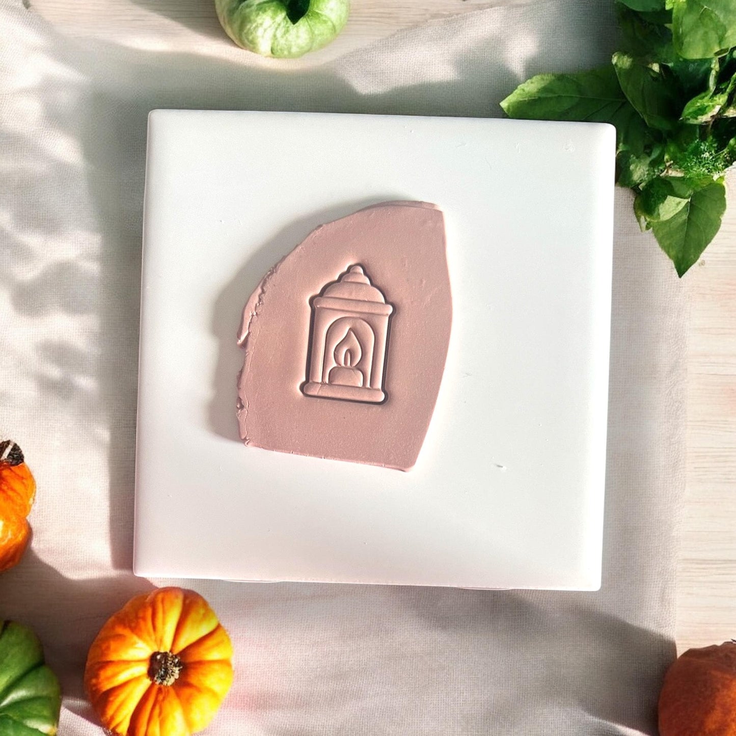 Clay slab with lantern cutter impression in soft mauve
