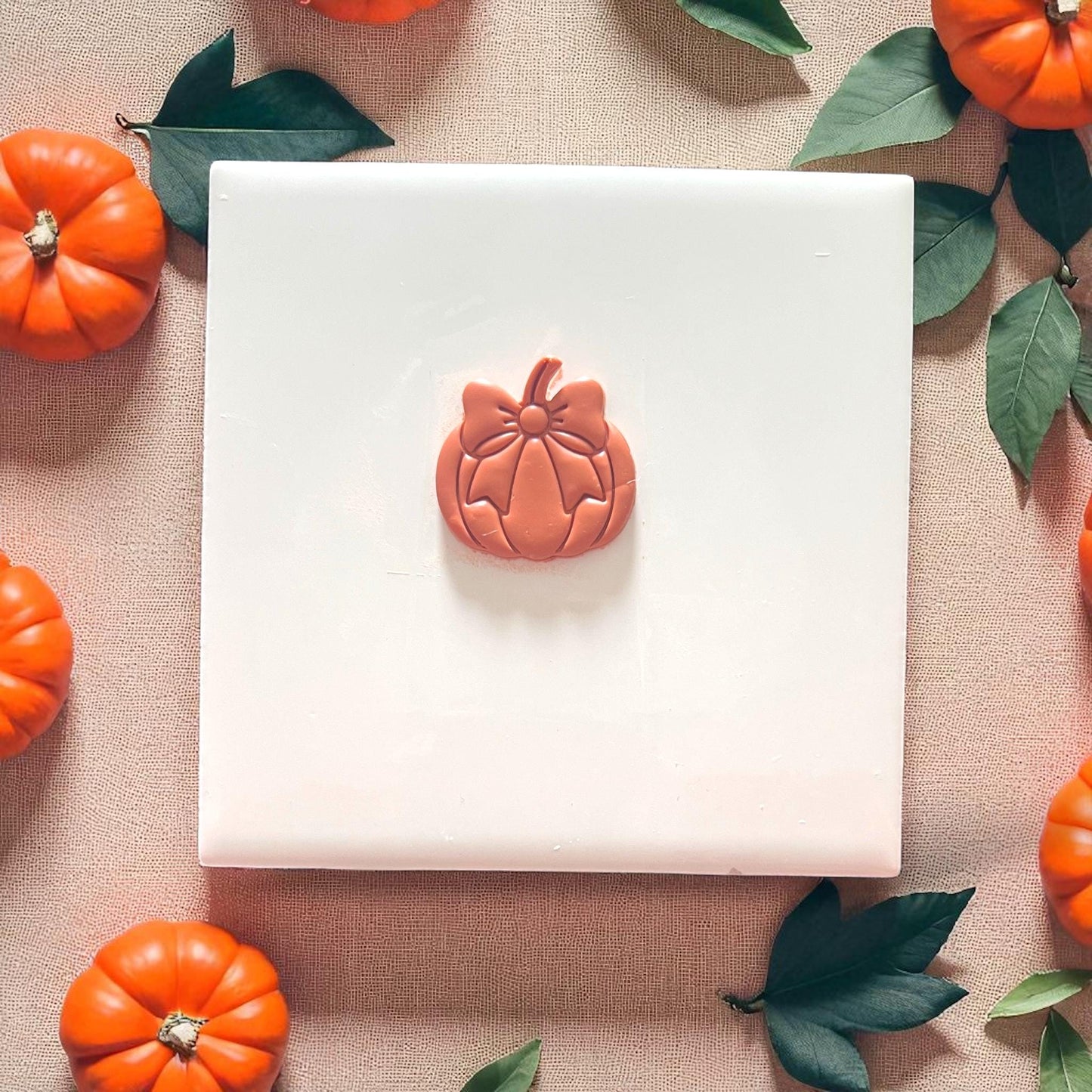 Pumpkin clay impression with bow in center