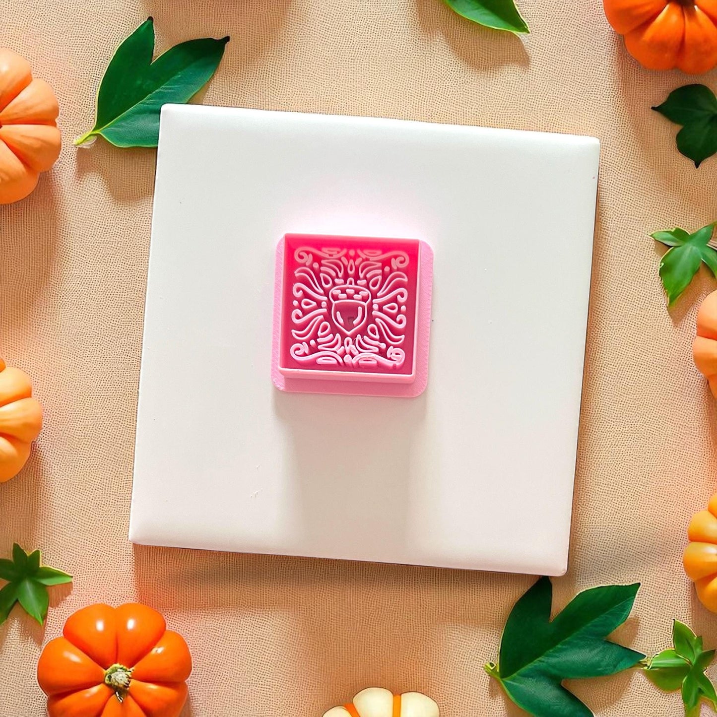 Pink cutter with acorn matisse design on white tile