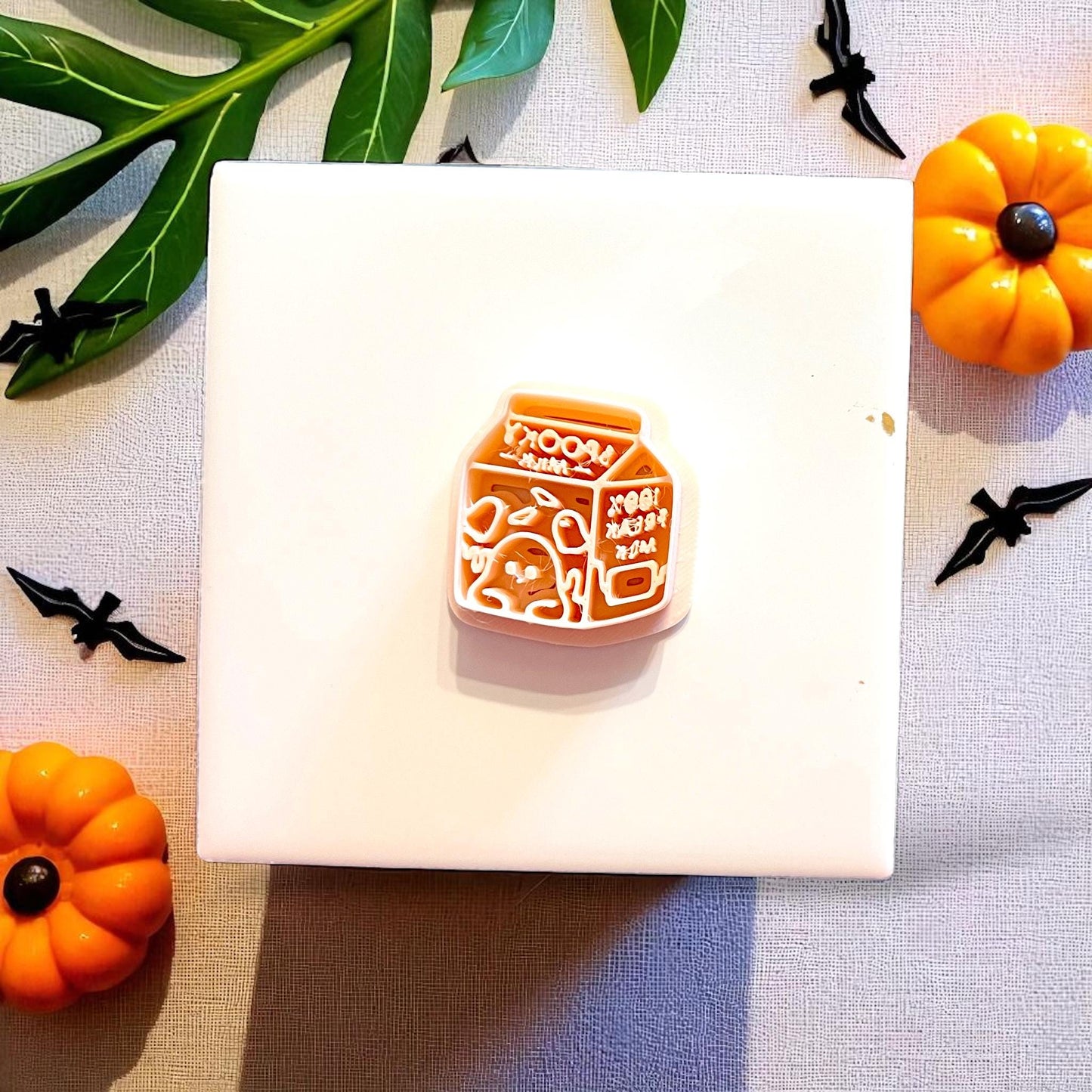 Orange ghost milk polymer clay cutter with engraved spooky design