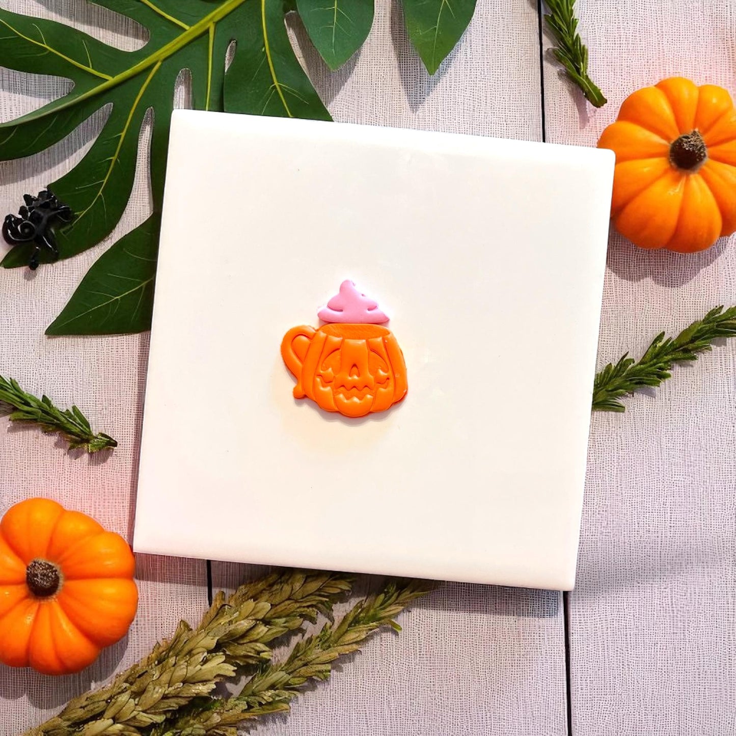 Finished pumpkin mug clay earring with whip topper