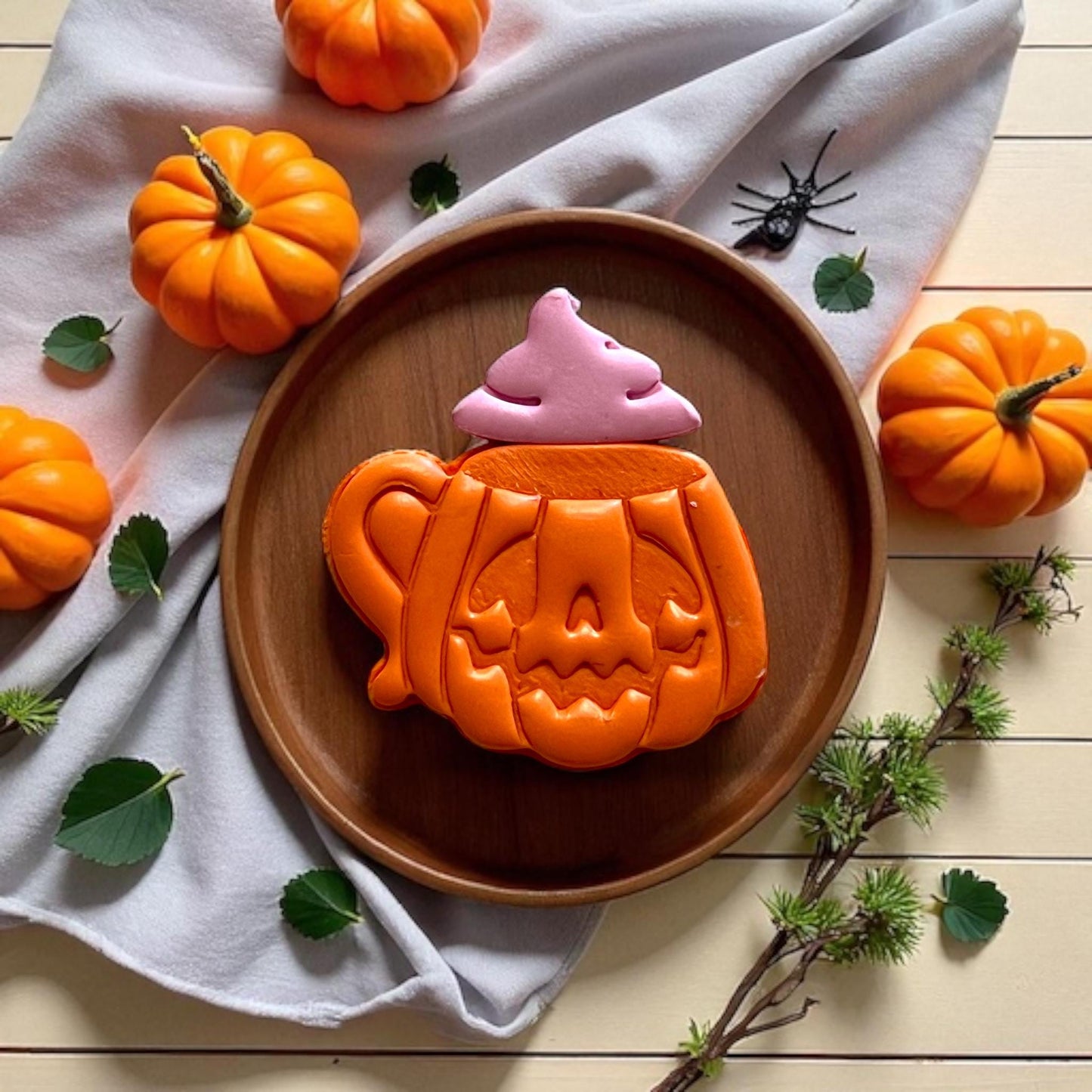 Large pumpkin mug with pink whip on wood tray