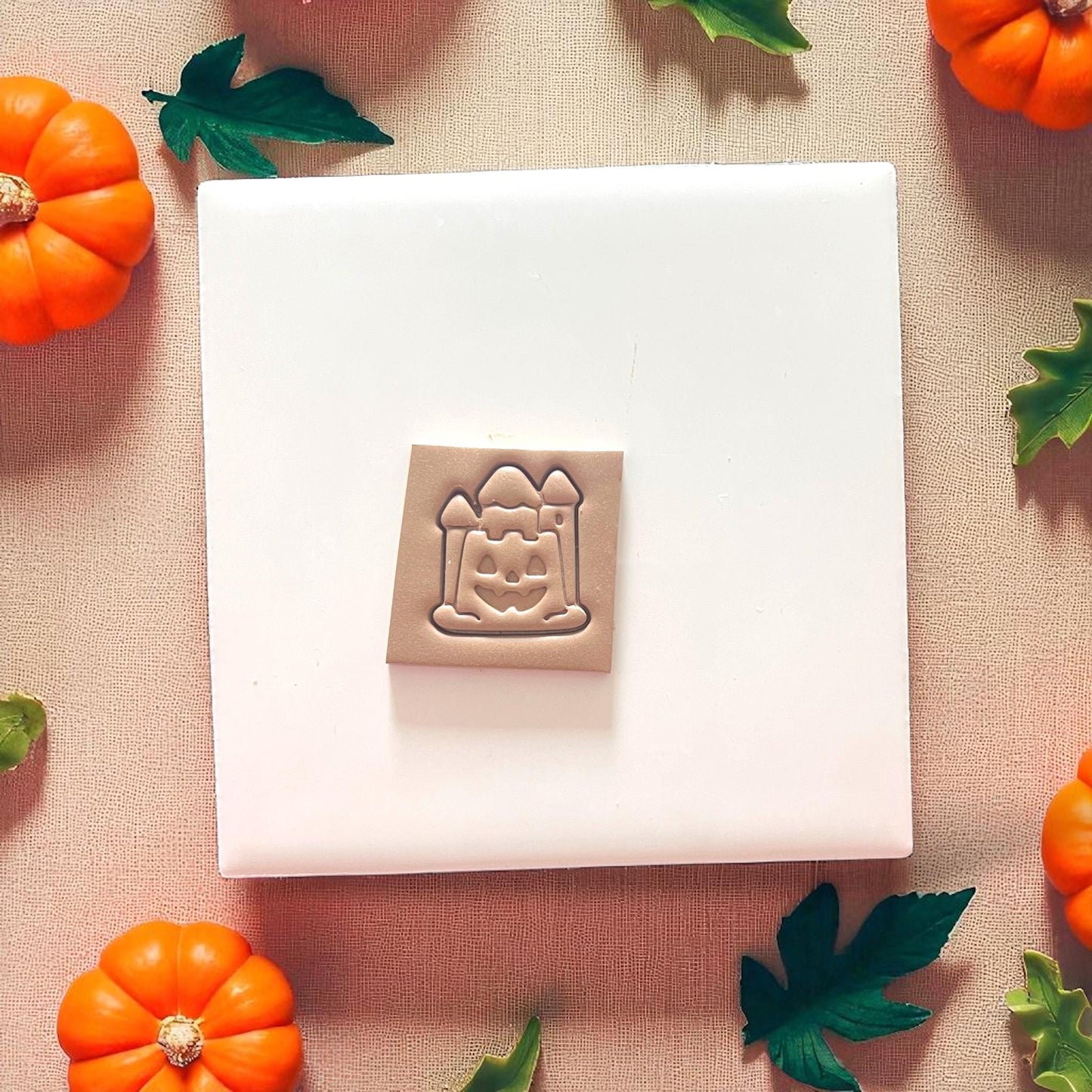 close-up of halloween pumpkin sandcastle clay impression