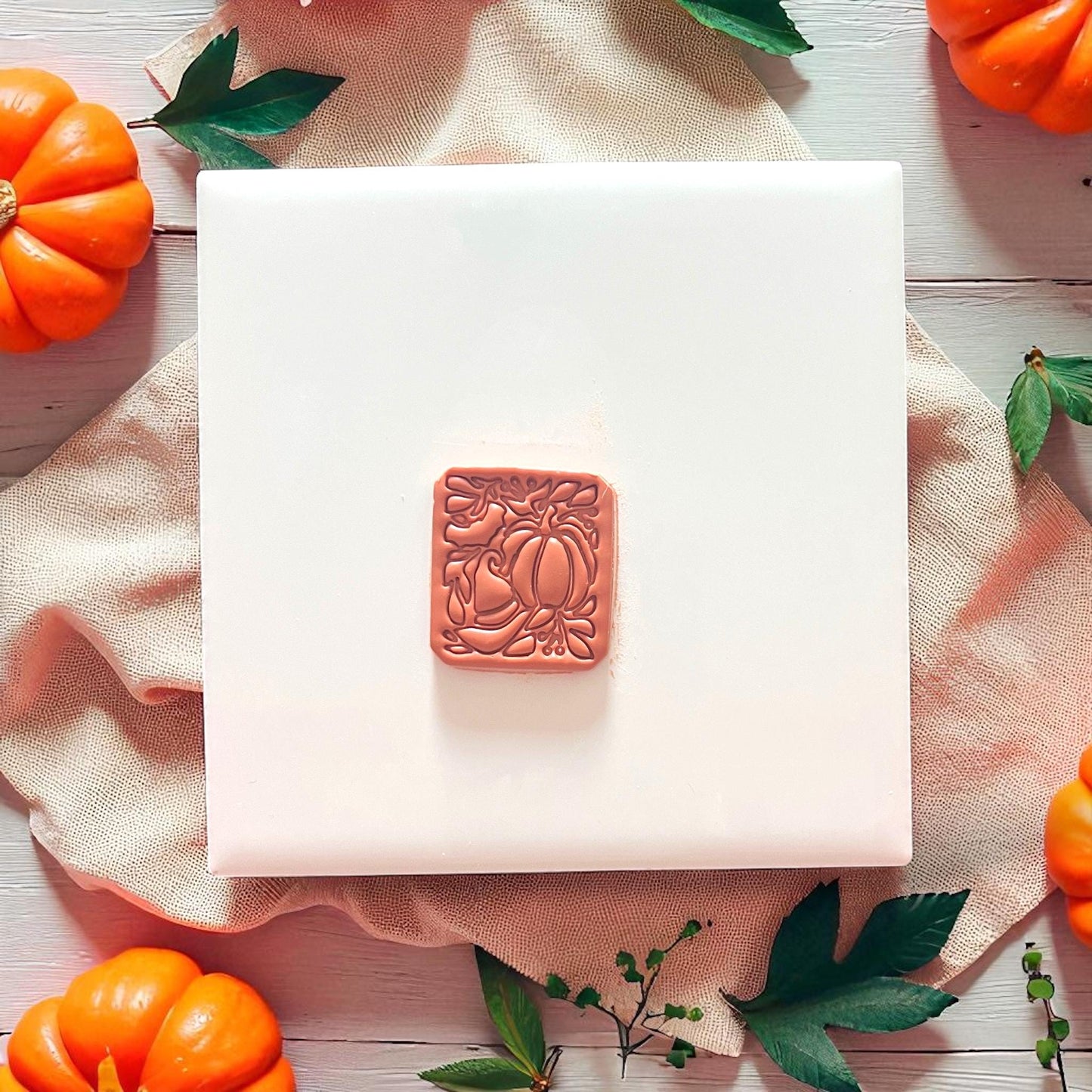 fall-inspired pumpkin witch hat motif on white display