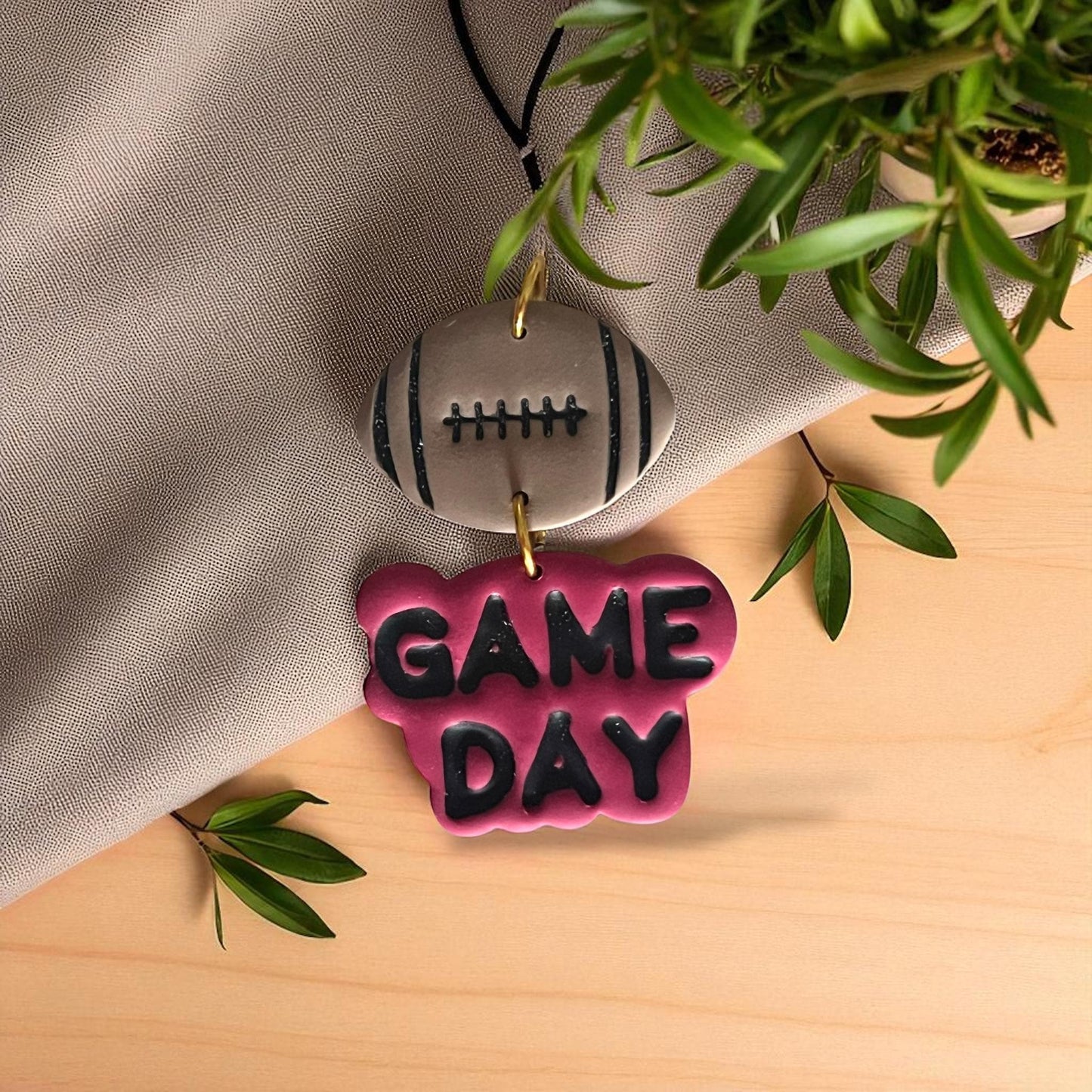Game Day football clay earrings with black text and football top piece