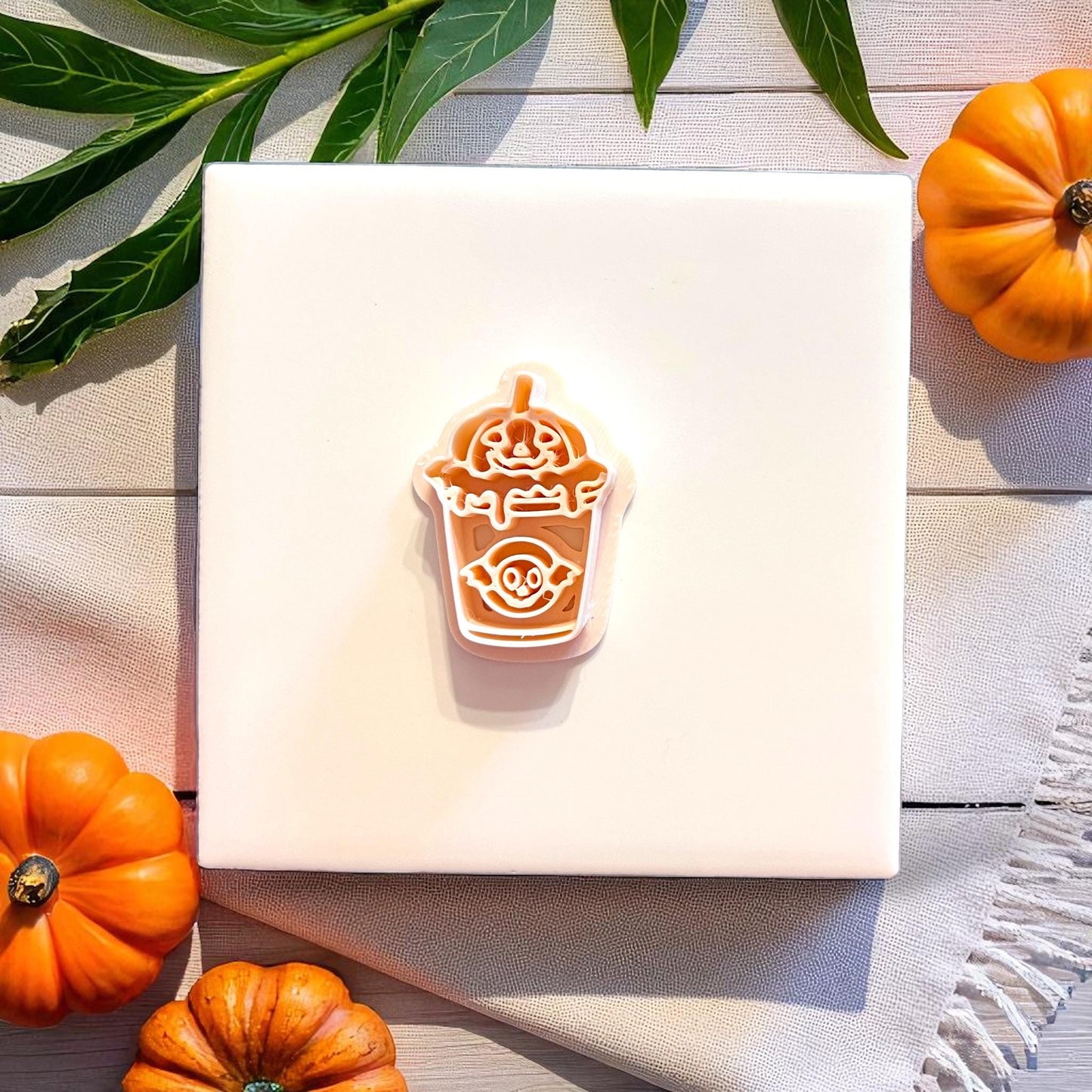 Ghost boba cutter shown with layered clay piece and pumpkins