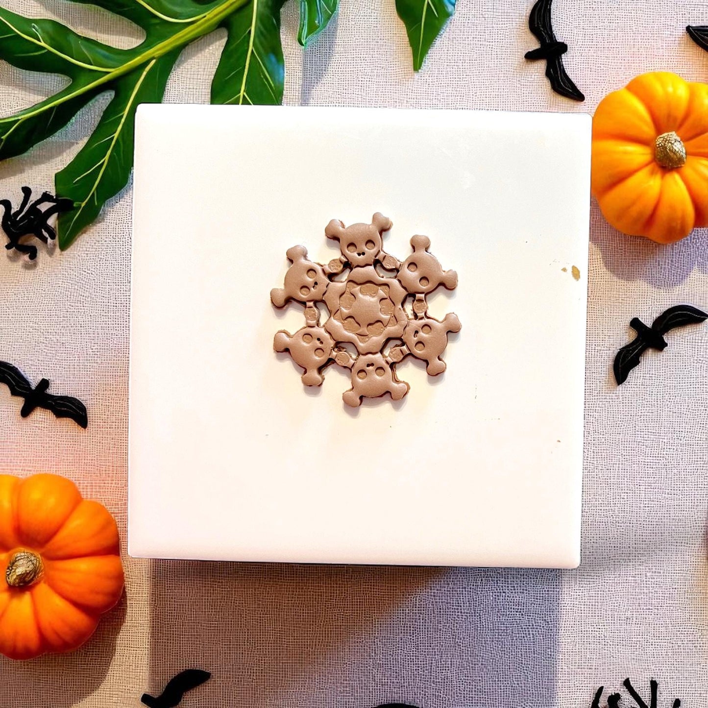 Halloween skull wreath polymer clay piece after cutting