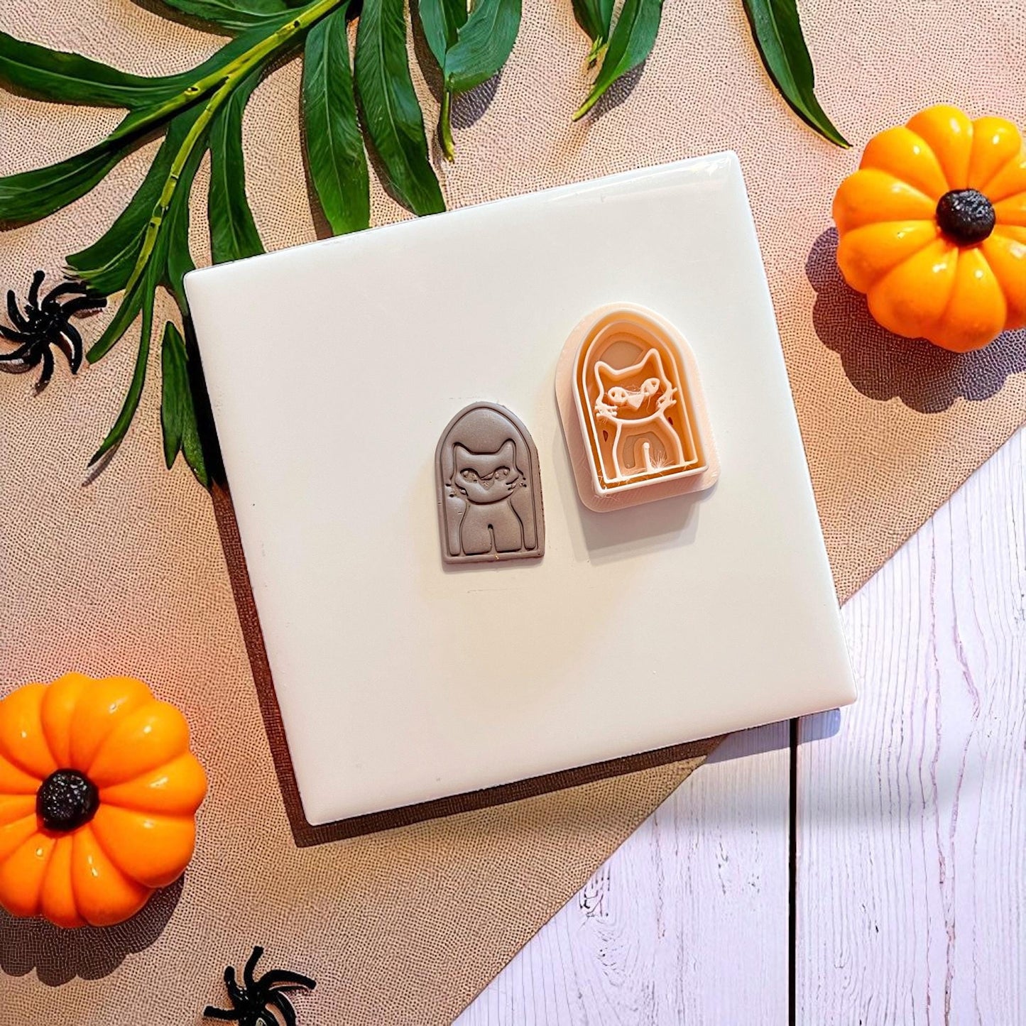 Spooky cat clay imprint with matching cutter next to it