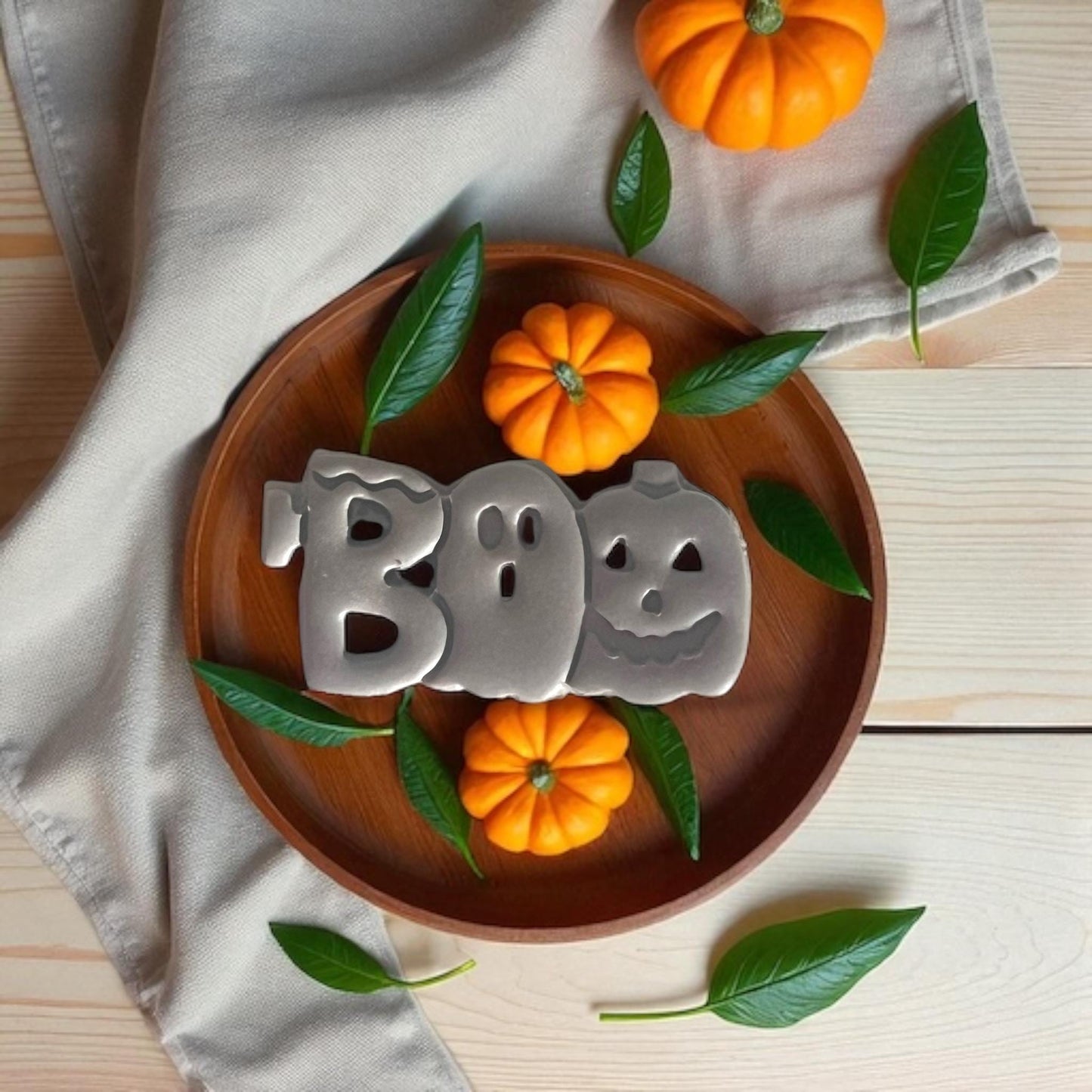 Finished BOO clay earrings styled with pumpkins