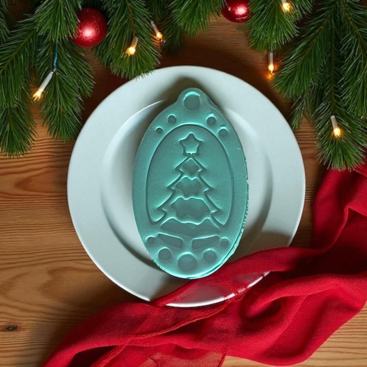 Pink tree ornament clay cutter centered on white tile with lights