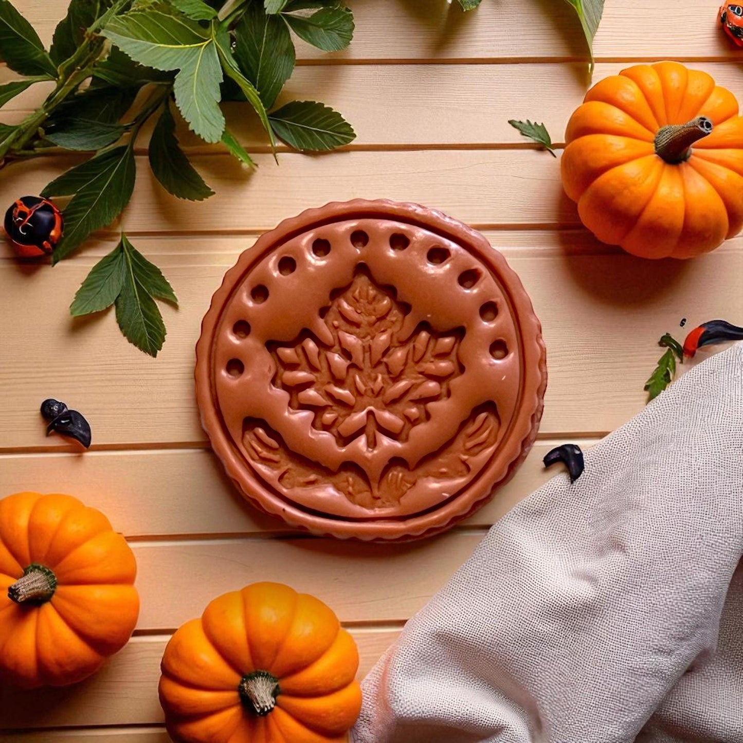 Maple leaf textured circle slab with leaf props and pumpkins