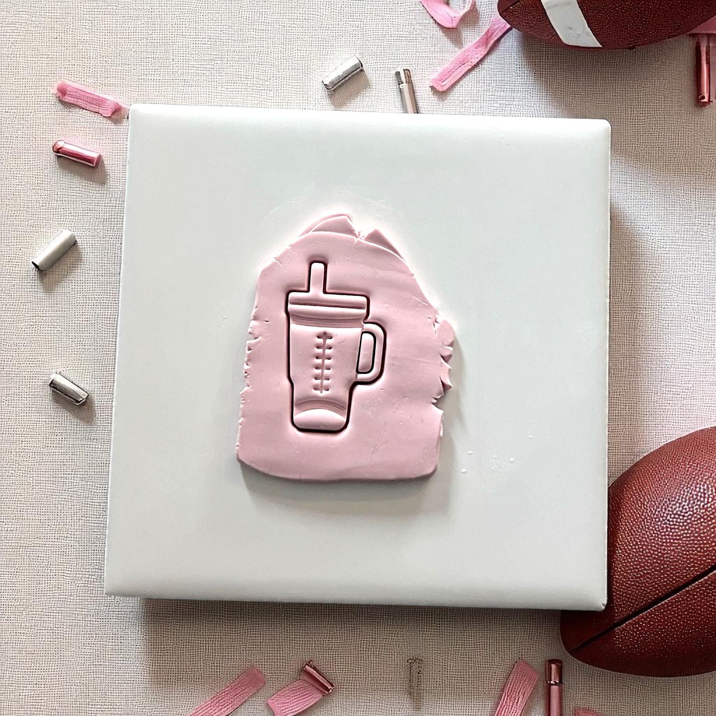 Football Stanley cup clay cutter impression in pink clay