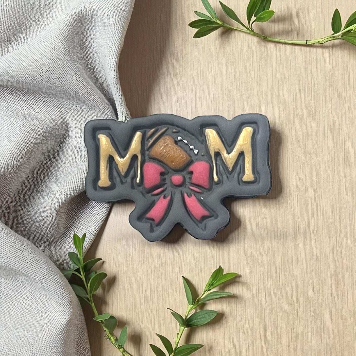 Football mom clay piece with bow in black, gold, and red
