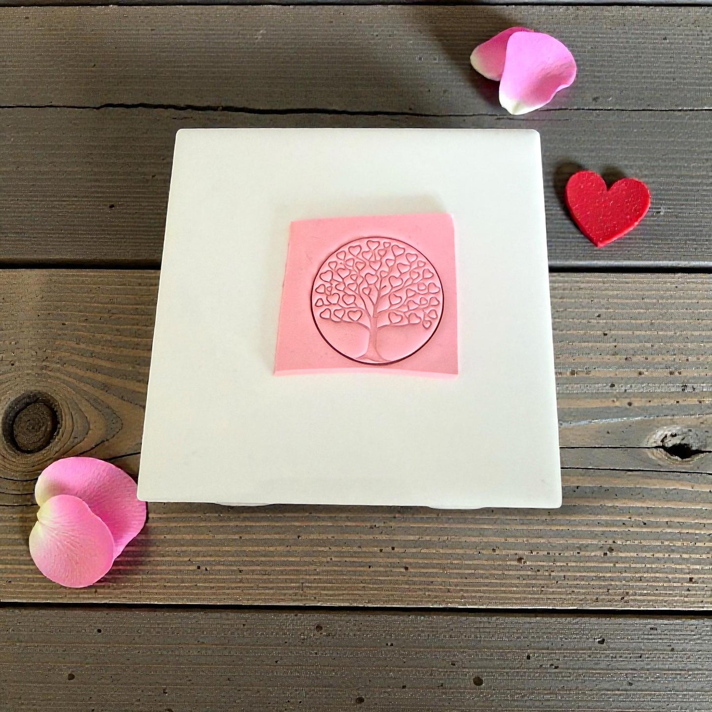 heart tree imprint on pink clay square
