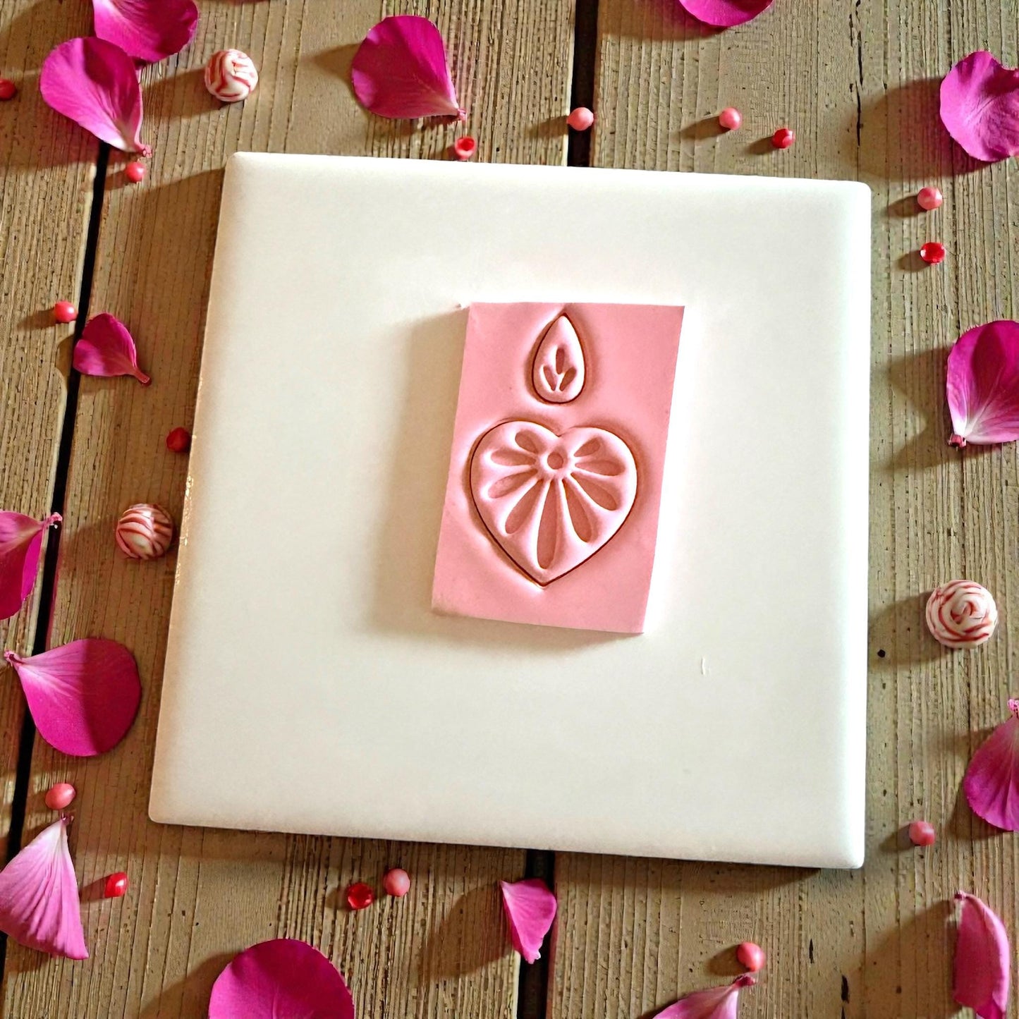 heart floral clay impression on pink slab