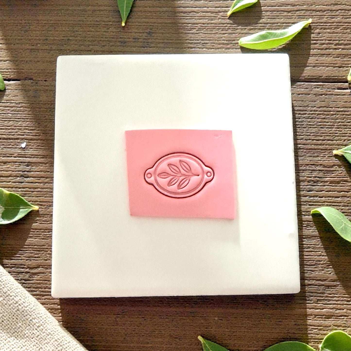 clay slab stamped with leaf bracelet connector cutter