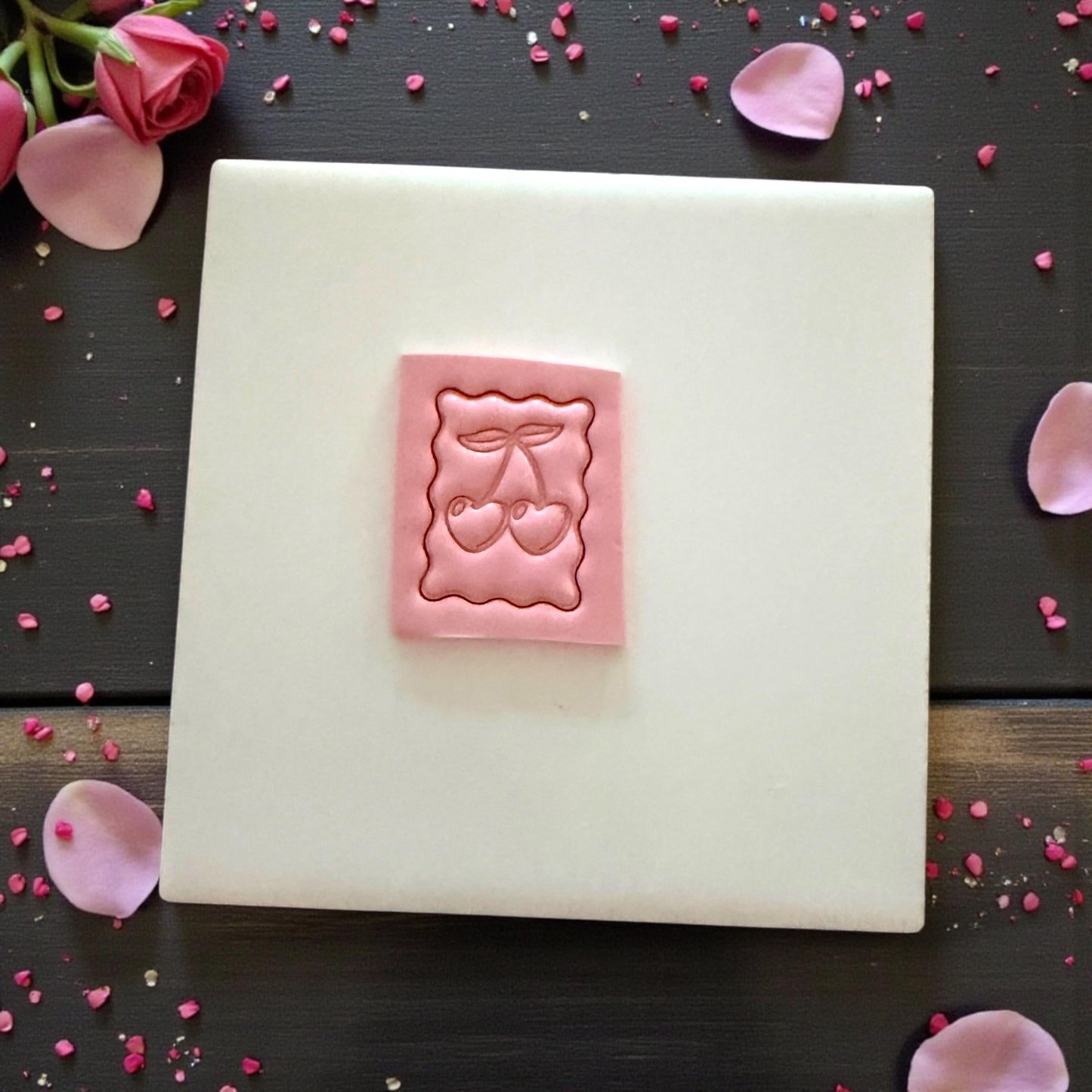 cherry postage stamp clay impression on tile