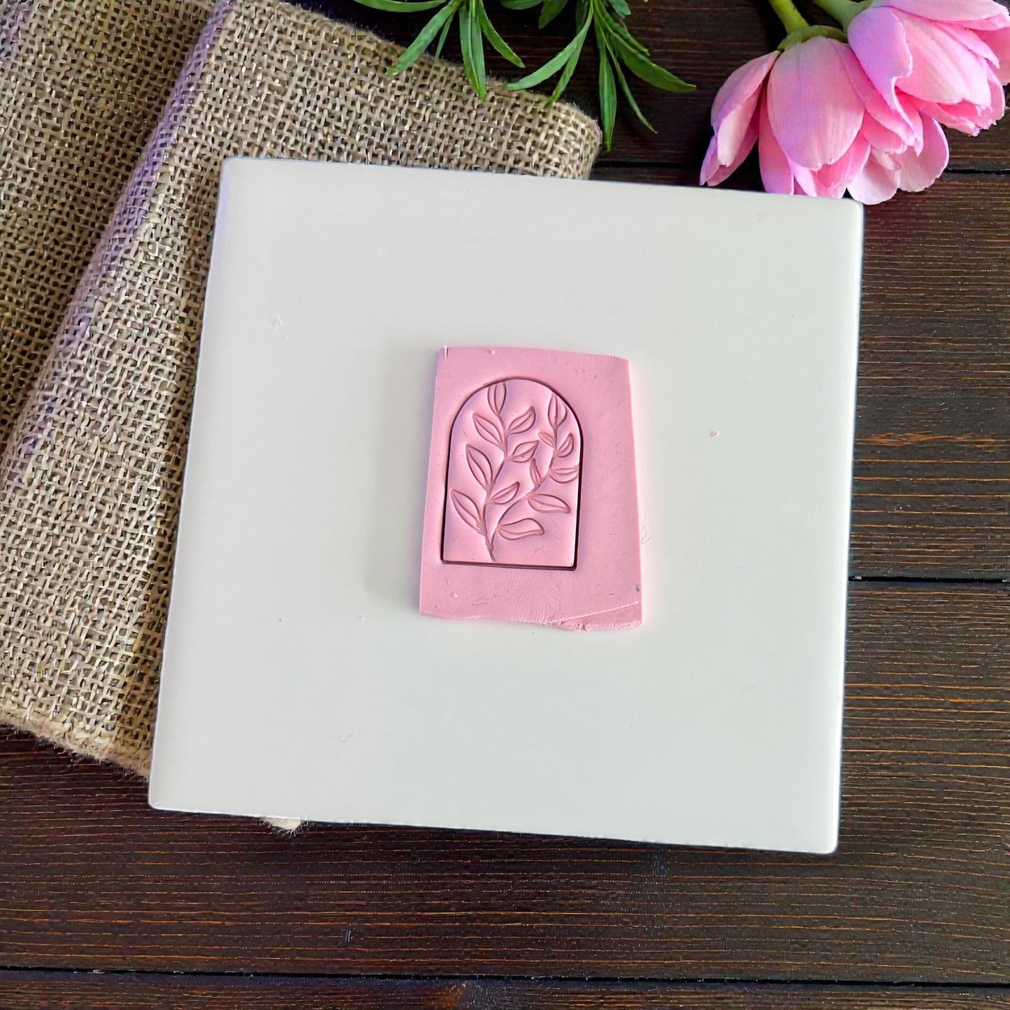 leaf arch polymer clay impression on pink clay