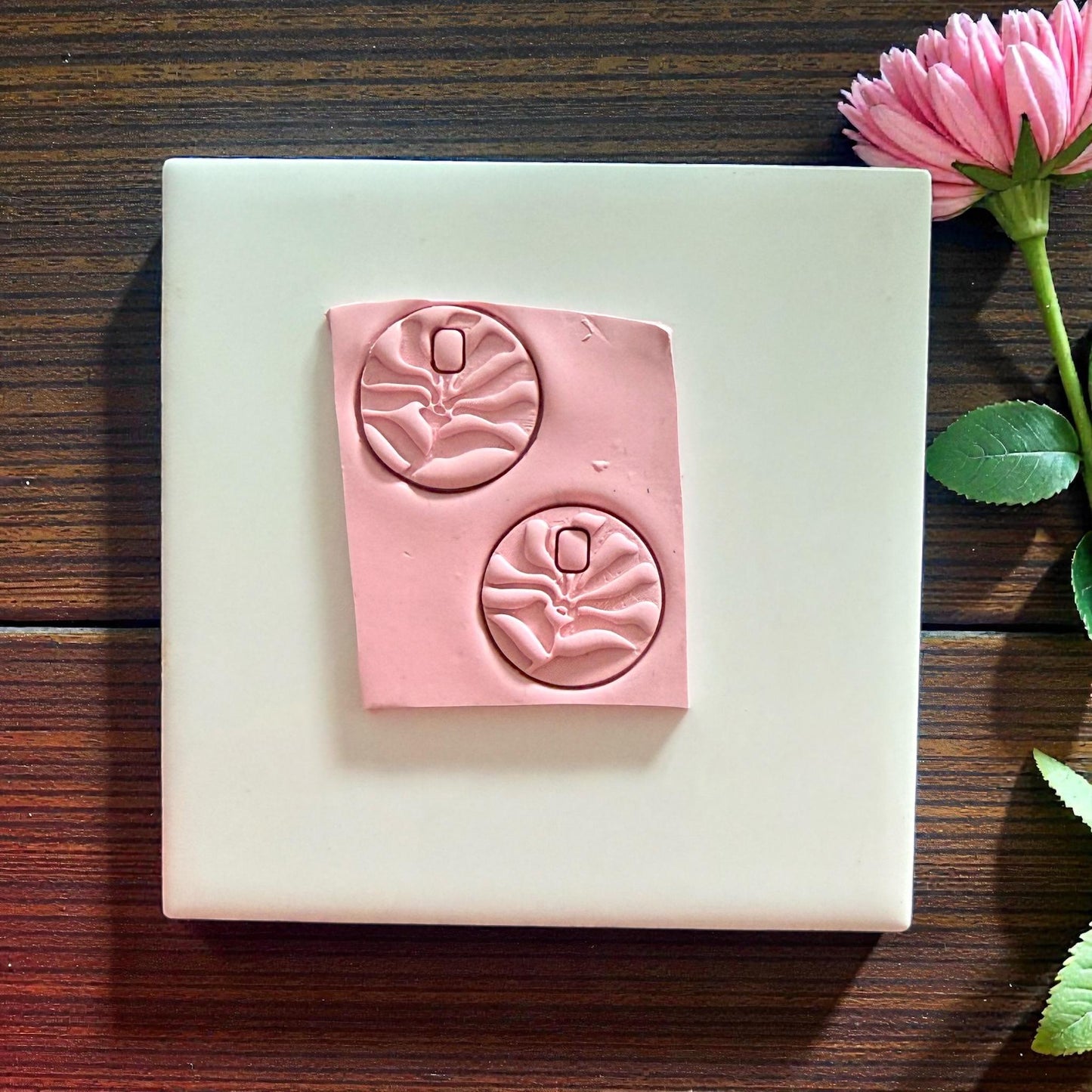 pink matisse flower shapes cut into clay sheet