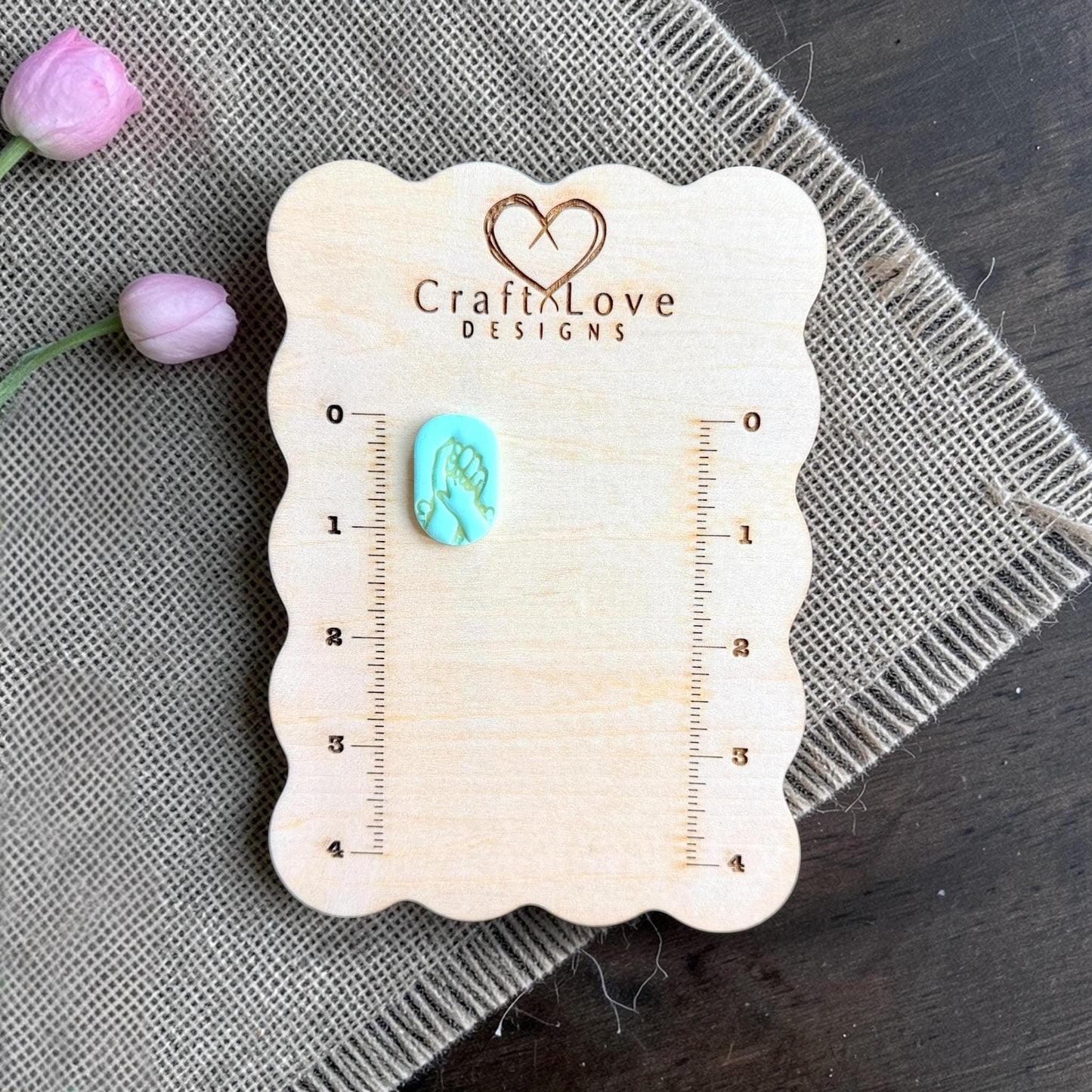 motherhood earring clay cutter with baby hand silhouette