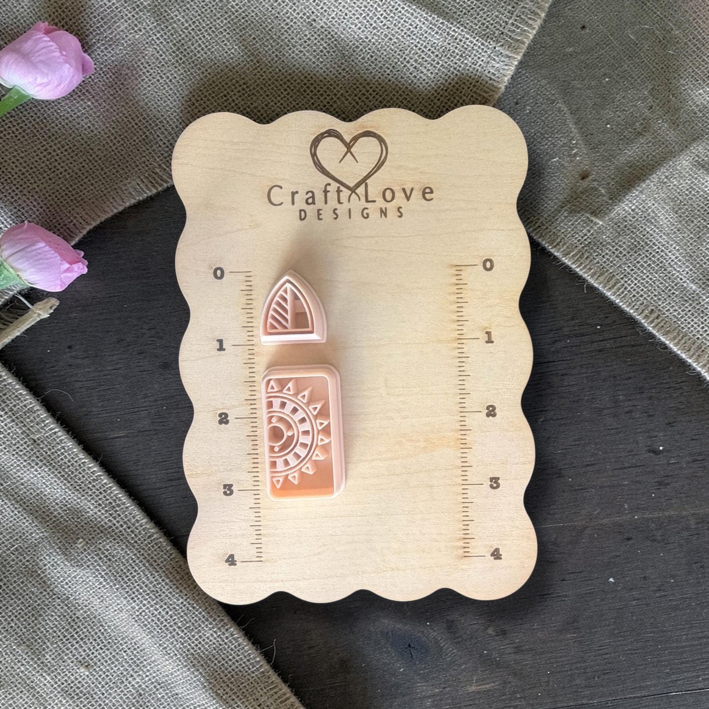 Polymer clay cutters displayed on Craft Love Designs wooden ruler board for size reference
