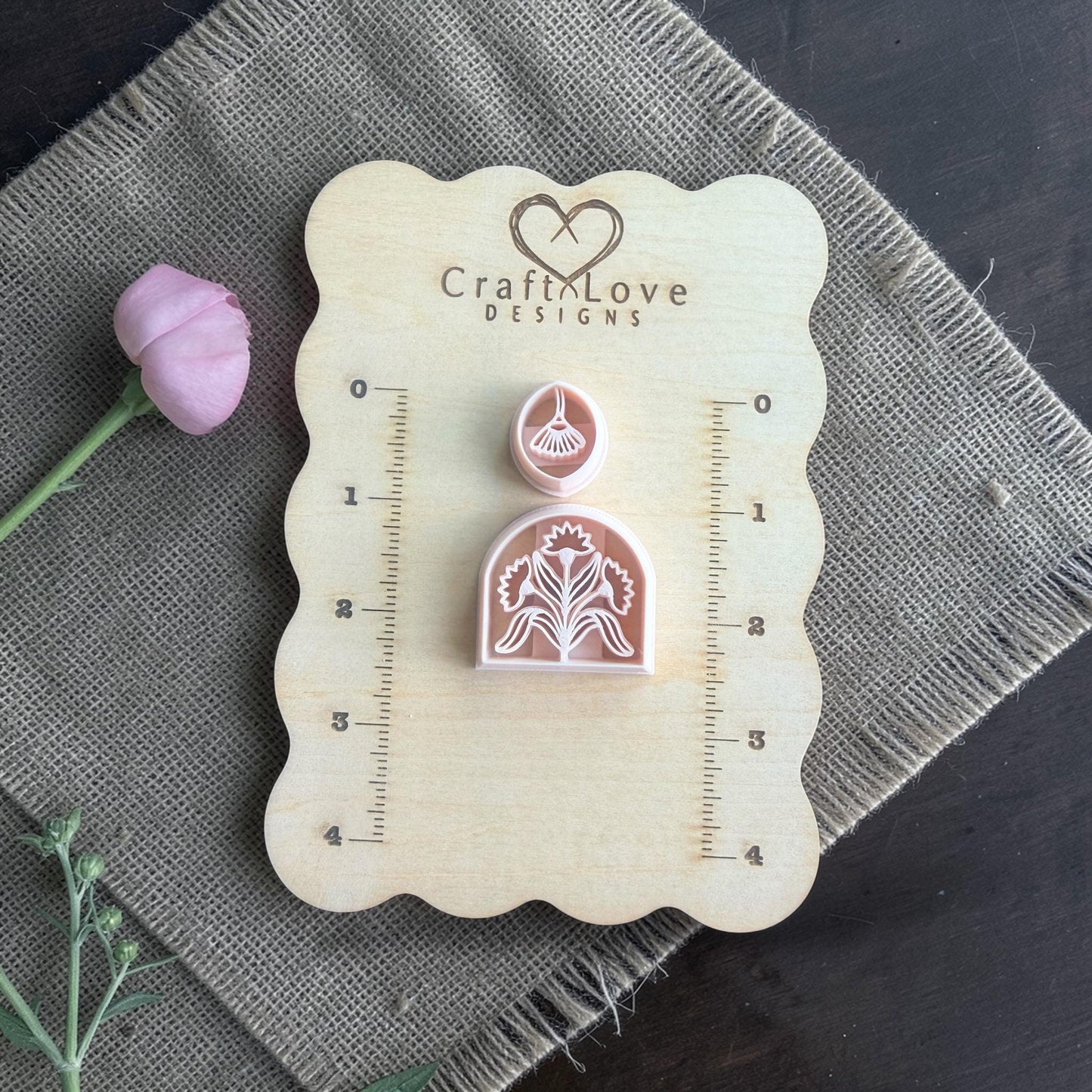 floral arch cutter and topper on wooden sizing board