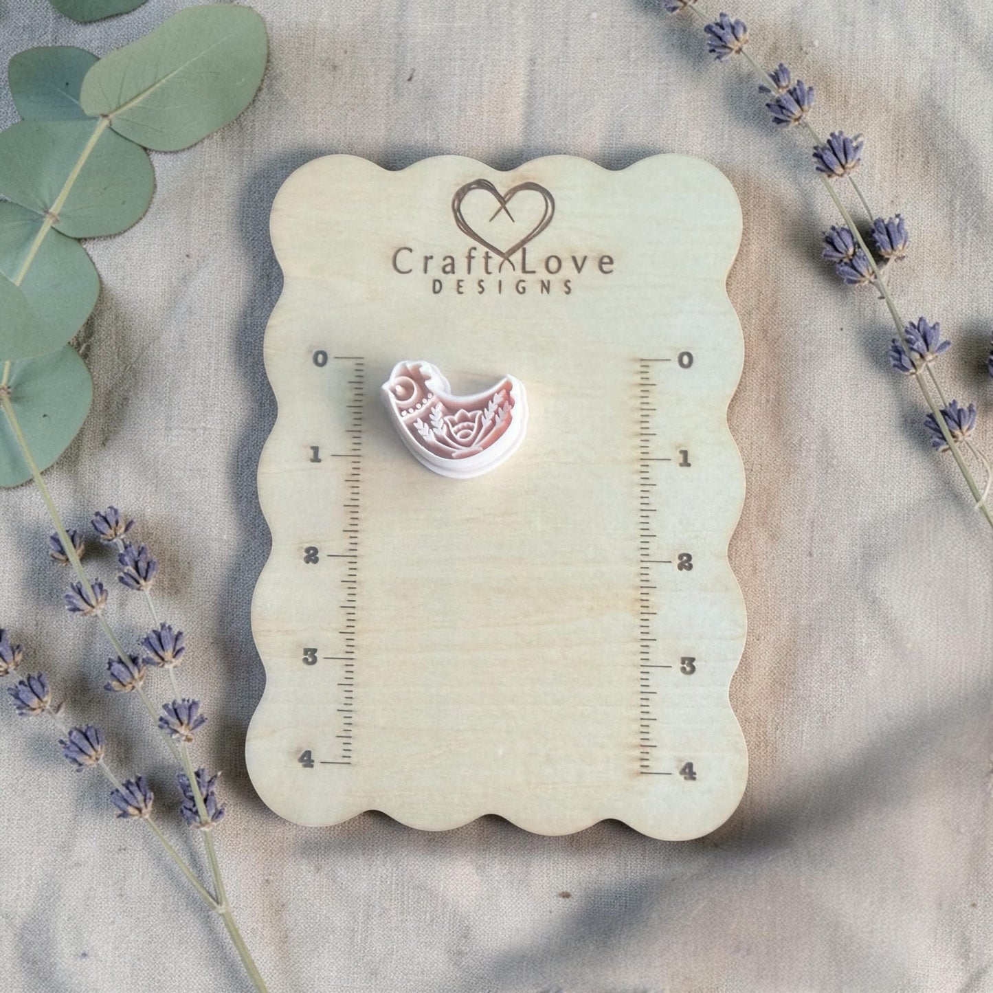 folk bird polymer clay cutters on measuring board craft love designs
