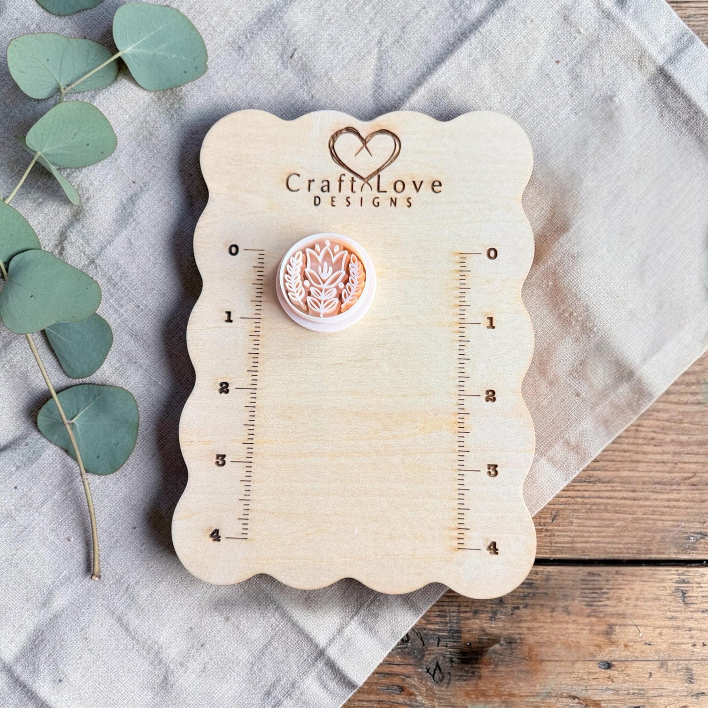 white tulip clay cutter displayed on Craft Love Designs ruler board