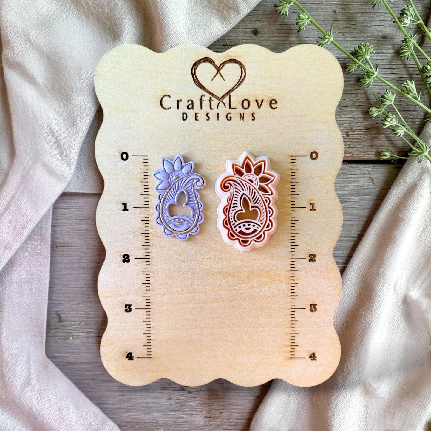 43mm paisley cutter displayed with finished example for size reference