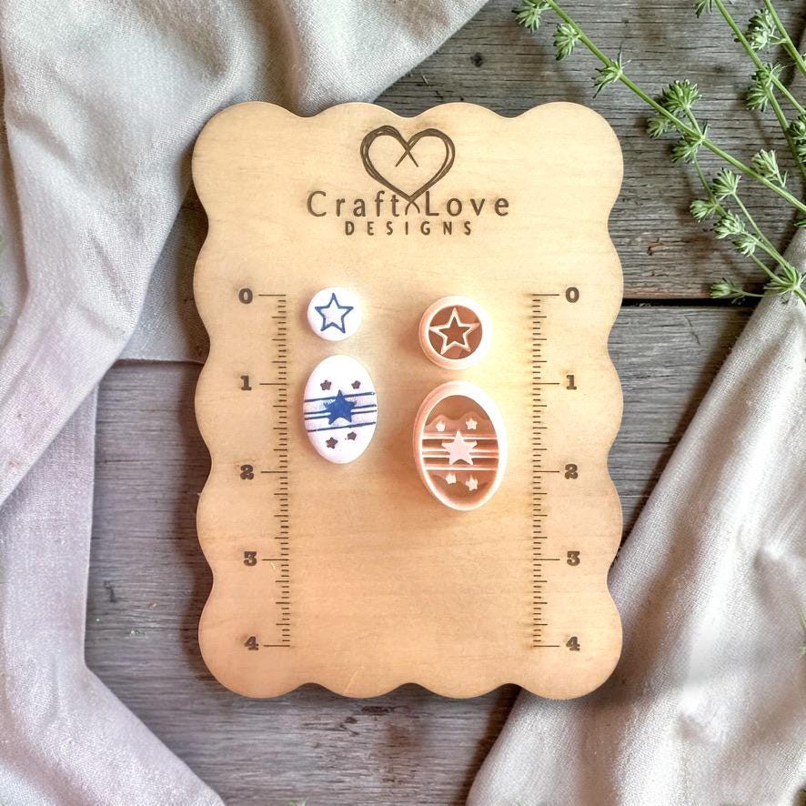 Star and striped oval cutters with finished clay pieces displayed on wooden measurement board