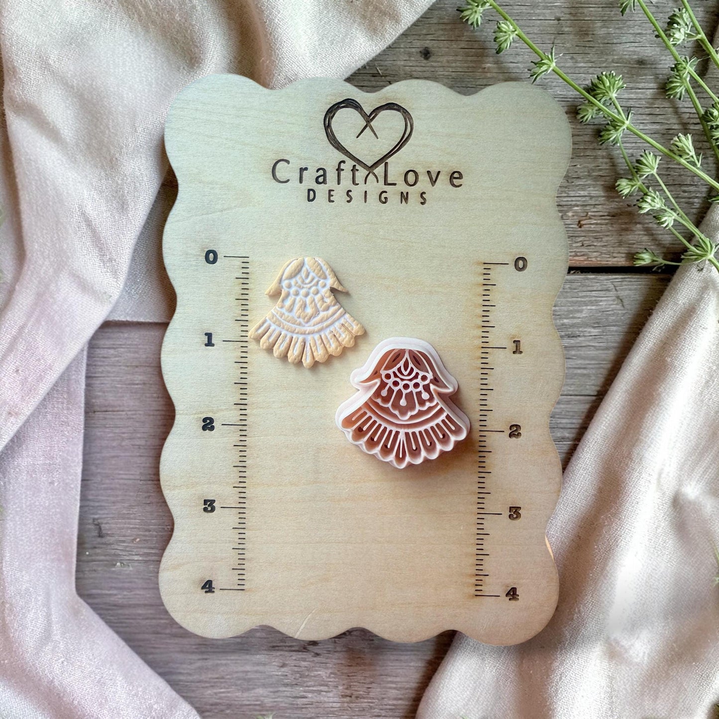 Boho fan polymer clay cutter displayed on wooden board with size guide