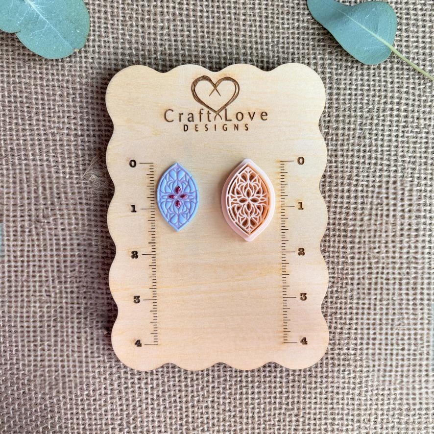 Teardrop clay cutter and finished piece displayed on wooden measurement board