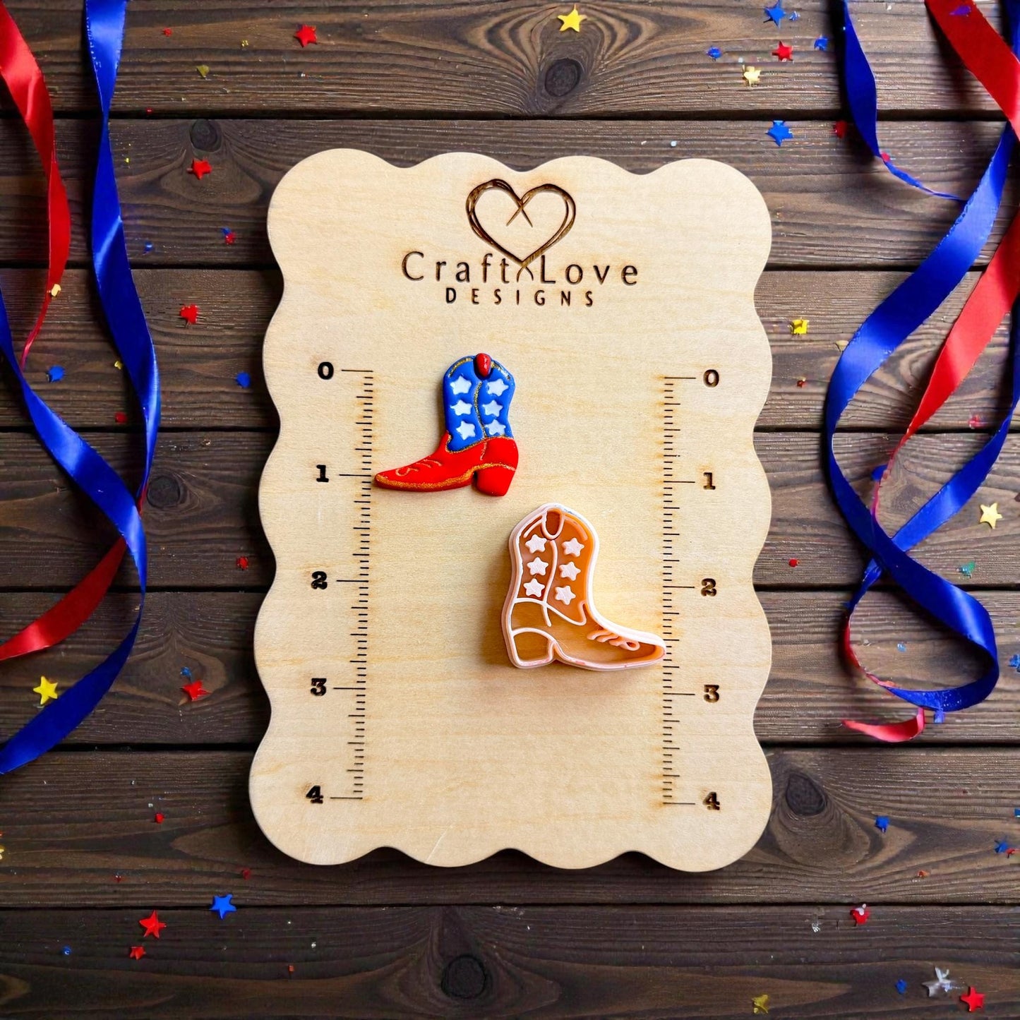 Patriotic cowboy boot polymer clay cutter displayed on wooden measurement board with red white and blue ribbon decorations