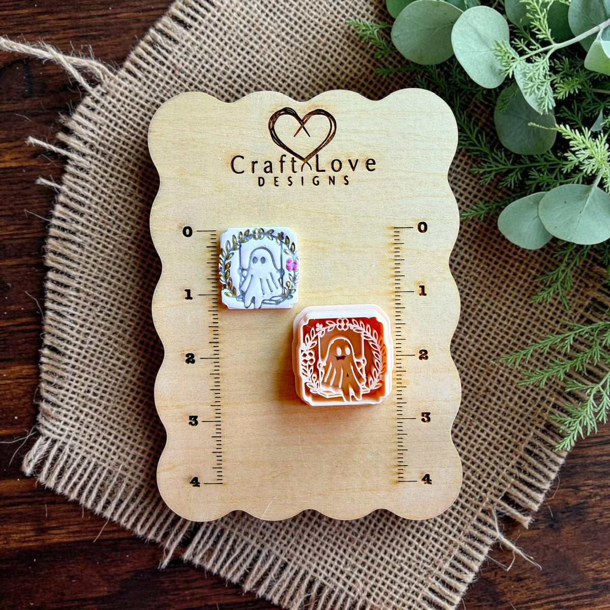 CraftLove Designs display board showing finished ghost earring and matching floral ghost polymer clay cutter with measurement scale.