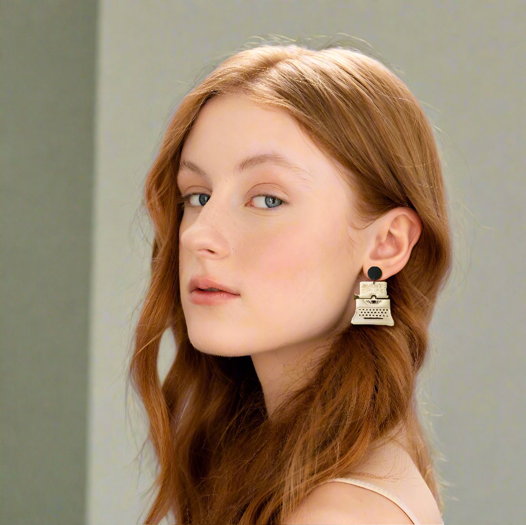 A woman wearing a Vintage writer-inspired earrings.