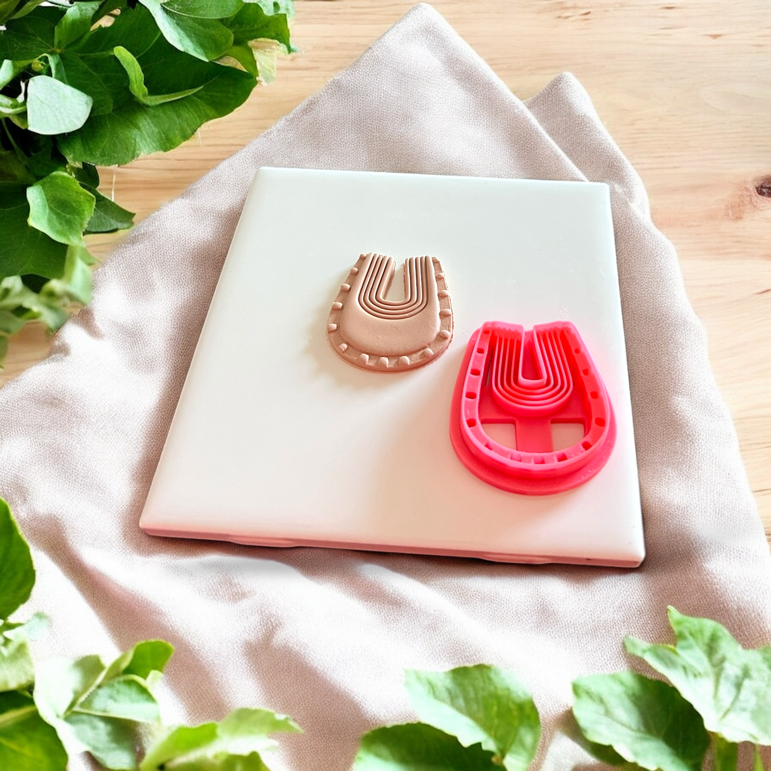 U shaped cutter pressed on beige clay
