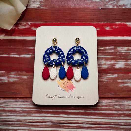 Unique 4th of July polymer clay dangle earrings featuring a patriotic red, white, and blue design, perfect for celebrations.