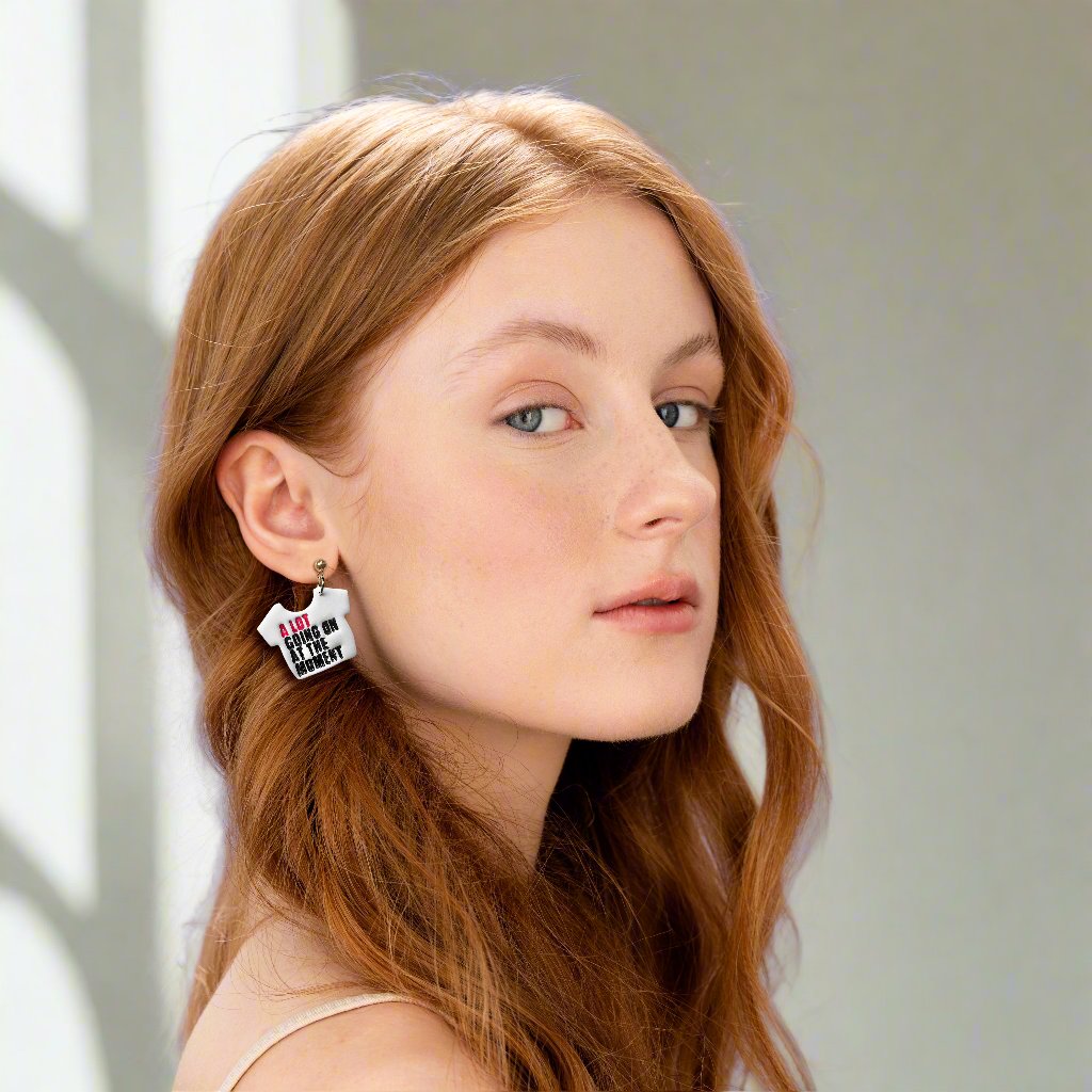 A Lot Going On at the Moment Statement earrings displayed on a beautiful young girl facing the camera.